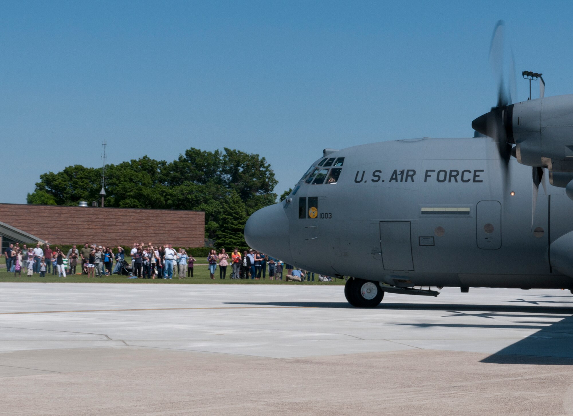 A Minnesota Air National Guard C-130 taxis past waiting family and friends at the Minneapolis- St. Paul International Airport on May 16, 2012, returning from a deployment to Southwest Asia. USAF official photo by Senior Master Sgt. Mark Moss