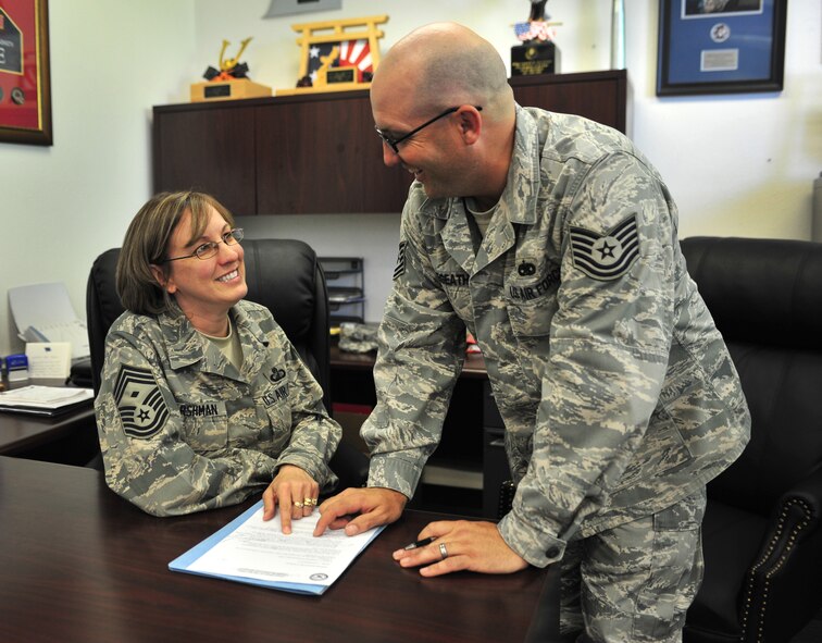 U.S. Air Force Chief Master Sgt. Lyn Harshman, 27th Special Operations Aircraft Maintenance Squadron first sergeant, is shown how to complete a form by Tech. Sgt. David Megeath, 27 SOAMXS assistant first sergeant, at Cannon Air Force Base, N.M., May 2, 2012. Harshman considers followership a key part in becoming a great leader. (U.S. Air Force photo by Airman 1st Class Alexxis Pons Abascal)  