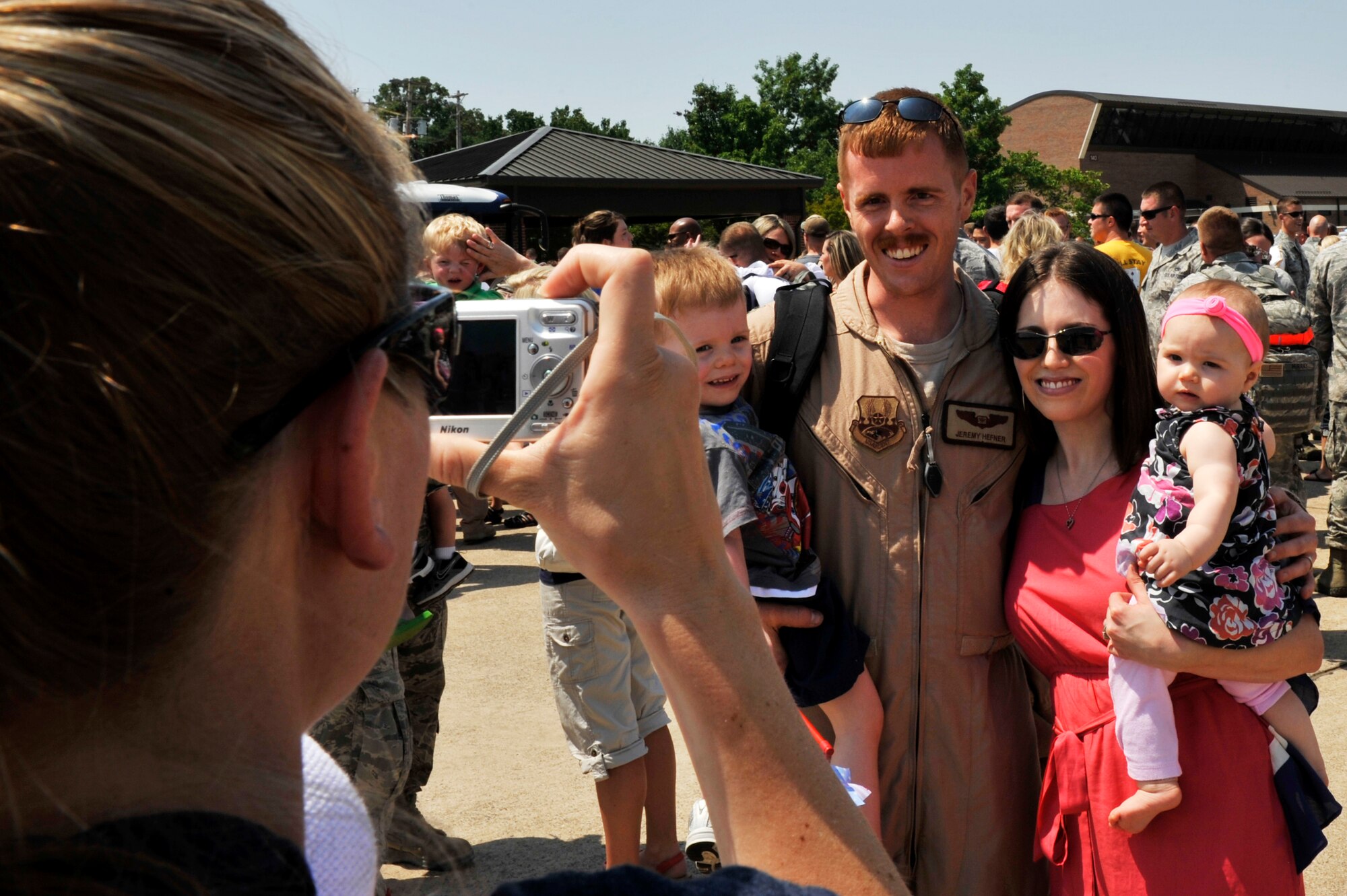 Capt. Robert Fletcher, a 61st Airlift Squadron navigator, and his wife, Danielle Worthy, pose for a photo on the flight line May 18, 2012, at Little Rock Air Force Base, Ark. Fletcher was one of a more than 100 Team Little Rock Airmen returning from deployments supporting combat operations in Southwest Asia. 