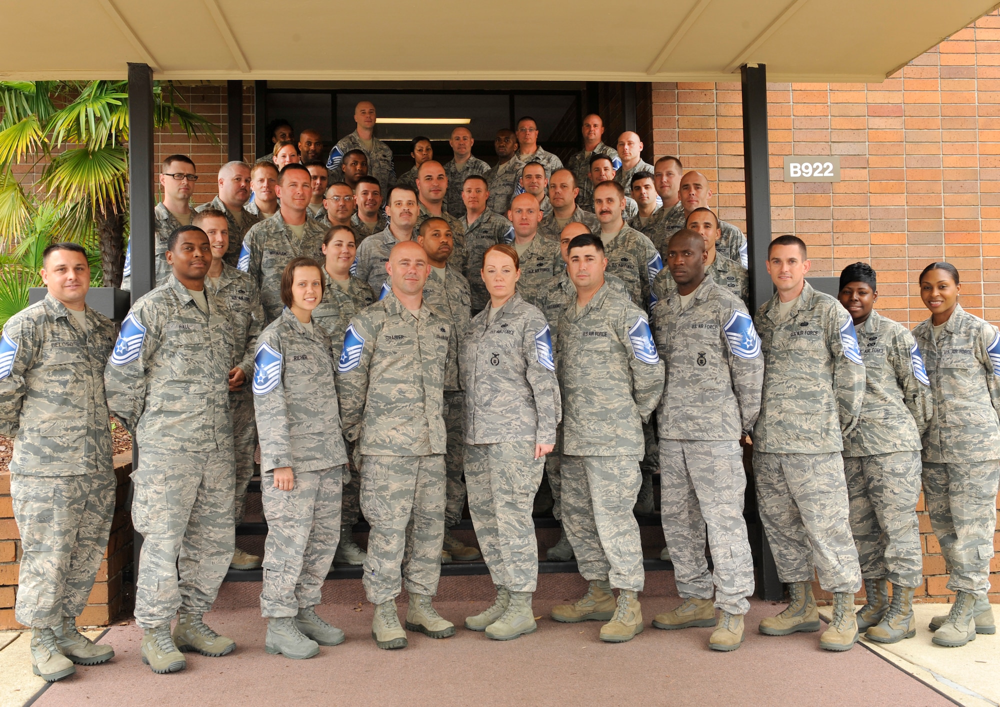 U.S. Air Force master sergeant selects pose for a group photo in front of the Carolina Skies Club on Shaw Air Force Base, S.C., May 18, 2012. Team Shaw has 81 new master sergeant selects. (U.S. Air Force photo by Senior Airman Amber E. N. Jacobs/Released) 