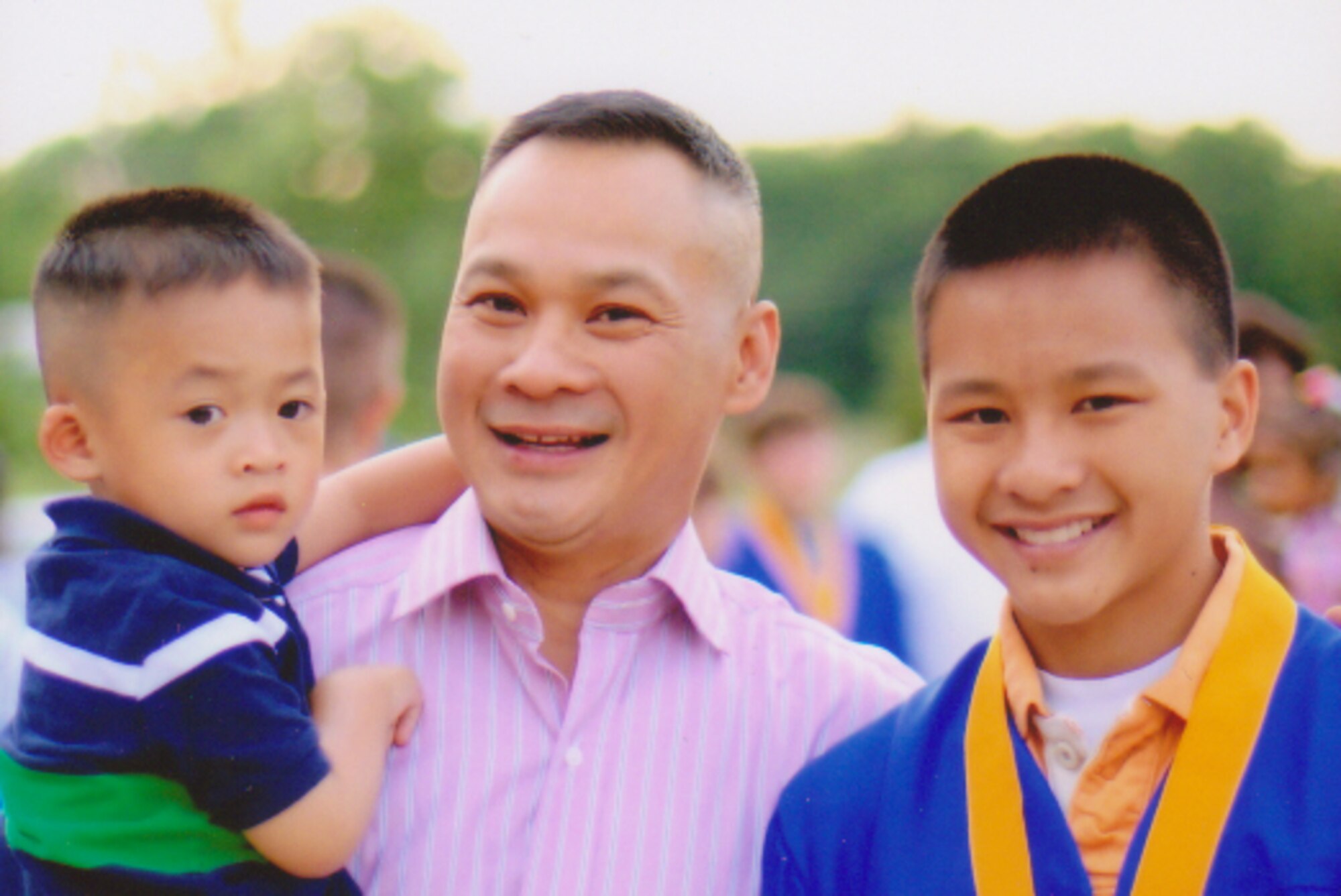 Hoang Nguyen shares his story with his two sons, Michael 15 and Alex 3. ( Courtesy photograph)