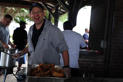 Retired Chief Master Sgt. Andy Comen mans the fryer during the Chiefs Annual Fish Fry, May 18 at Joint Base Charleston - Air Base, S.C.  The fish fry began as a barbeque in 1987 and was a way to unite the Reserve and active-duty members on the air base.  (U.S. Air Force photo/ Staff Sgt. Nicole Mickle)  