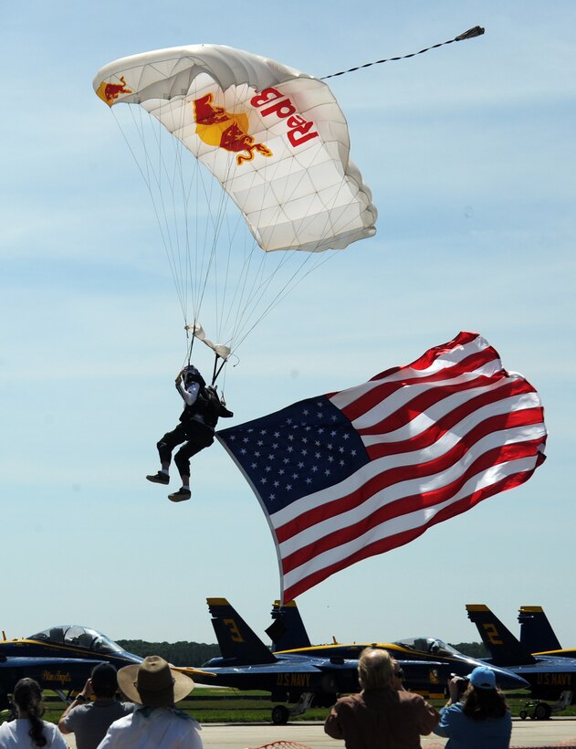 A parachutist from Team Red Bull prepares for landing during 2012 Joint Service Open House and Air Show May 18. This year's JSOH celebrates the Centennial of Marine Corps Aviation. JSOH affords the public an opportunity to meet the men and women of the Armed Forces while viewing over 100 static displays and 19 aerial demonstration teams. (U.S. Air Force photo/ Staff Sgt. Keyonna Fennell)