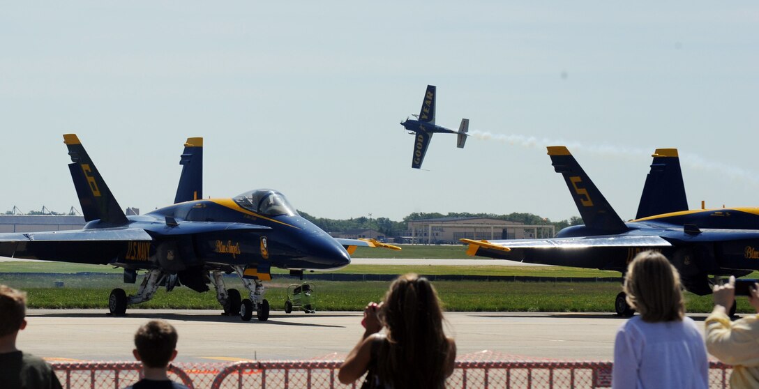 Mike Goulian, Goodyear aerial acrobat, performs for the crowd during Joint Service Open House at Joint Base Andrews May 18. This year's JSOH celebrates the Centennial of Marine Corps Aviation. JSOH affords the public an opportunity to meet the men and women of the Armed Forces while viewing over 100 static displays and 19 aerial demonstration teams. (U.S. Air Force photo/ Staff Sgt. Keyonna Fennell)