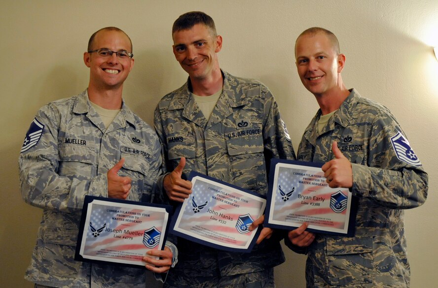 Selectees pose during the master sergeant selection party on Barksdale Air Force Base, La., May 17. The event was held to congratulate the technical sergeants who were notified of their selection for promotion earlier that morning. More than 70 selectees were on hand to be recognized. (U.S. Air Force photo/Staff Sgt. Chad Warren)(RELEASED)