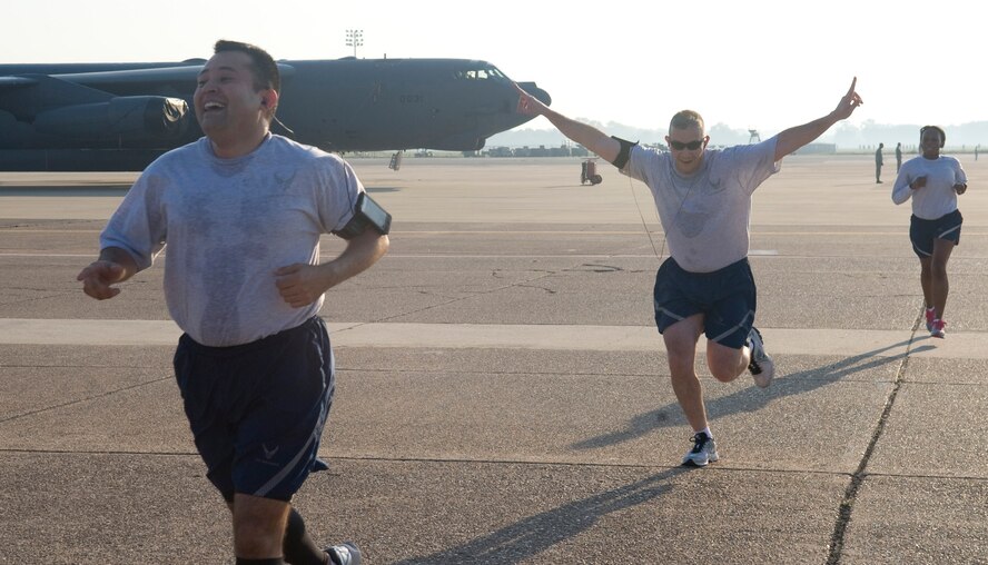 Master Sgt. James McClure, 2nd Force Support Squadron, celebrates as he completes the 5K Fun Run on Barksdale Air Force Base, La., May 18. The Fun Run was held to kick off the upcoming 101 Critical Days of Summer at Barksdale. (U.S. Air Force photo/Senior Airman Kristin High)(RELEASED)