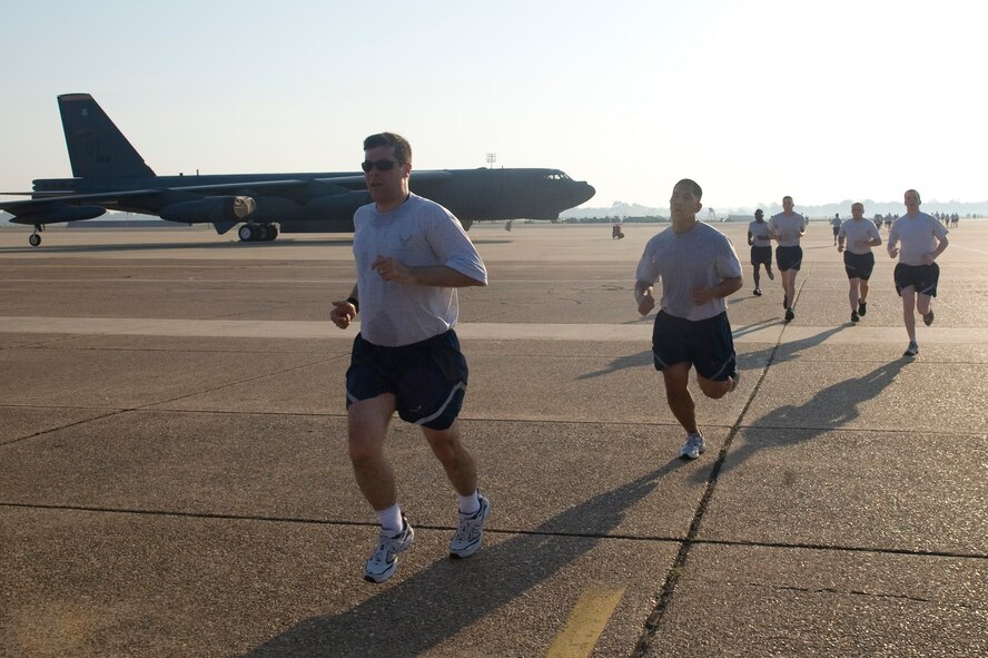 Col. Andrew Gebara, 2nd Bomb Wing commander, finishes the 5K Fun Run on the flightline of Barksdale Air Force Base, La., May 18. The Fun Run was held to kick off the upcoming 101 Critical Days of Summer safety campaign at Barksdale. (U.S. Air Force photo/Senior Airman Kristin High)(RELEASED)