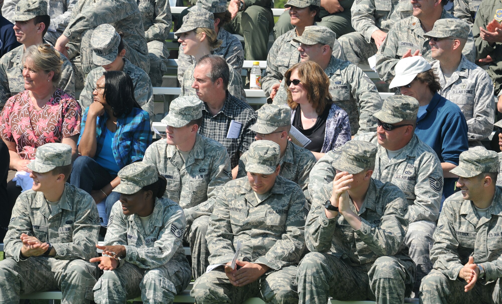 Team Scott members laugh as Col. Mike Hornitschek, former 375th Air Mobility Wing commander, makes a joke during the change of command ceremony May 18 at Scott Air Force Base, Ill. Col. David Almand assumed command of the 375th AMW and arrived from MacDill Air Force Base, Fla., where he served as the 6th Air Mobility Wing vice commander,  (U.S. Air Force photo/Airman 1st Class Kristina Lynch)