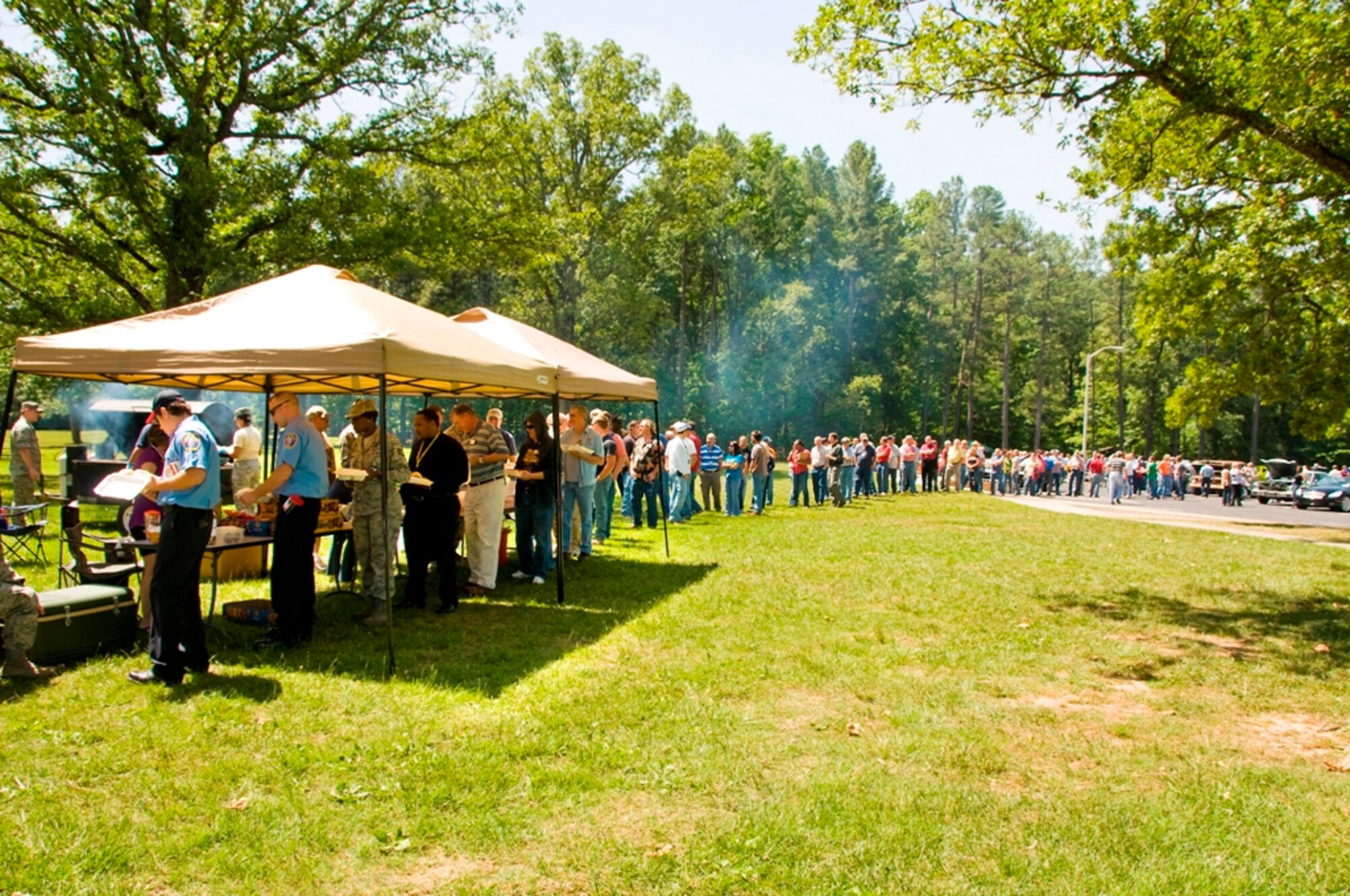 AEDC employees turned out in large numbers for AEDC’s Cruise-In May 11 to see the vehicles their coworkers brought out to display. The lunch tent, where the base’s Sergeants Association was grilling hamburgers and hot dogs, stayed busy during the event. (Photo by Jacqueline Cowan)