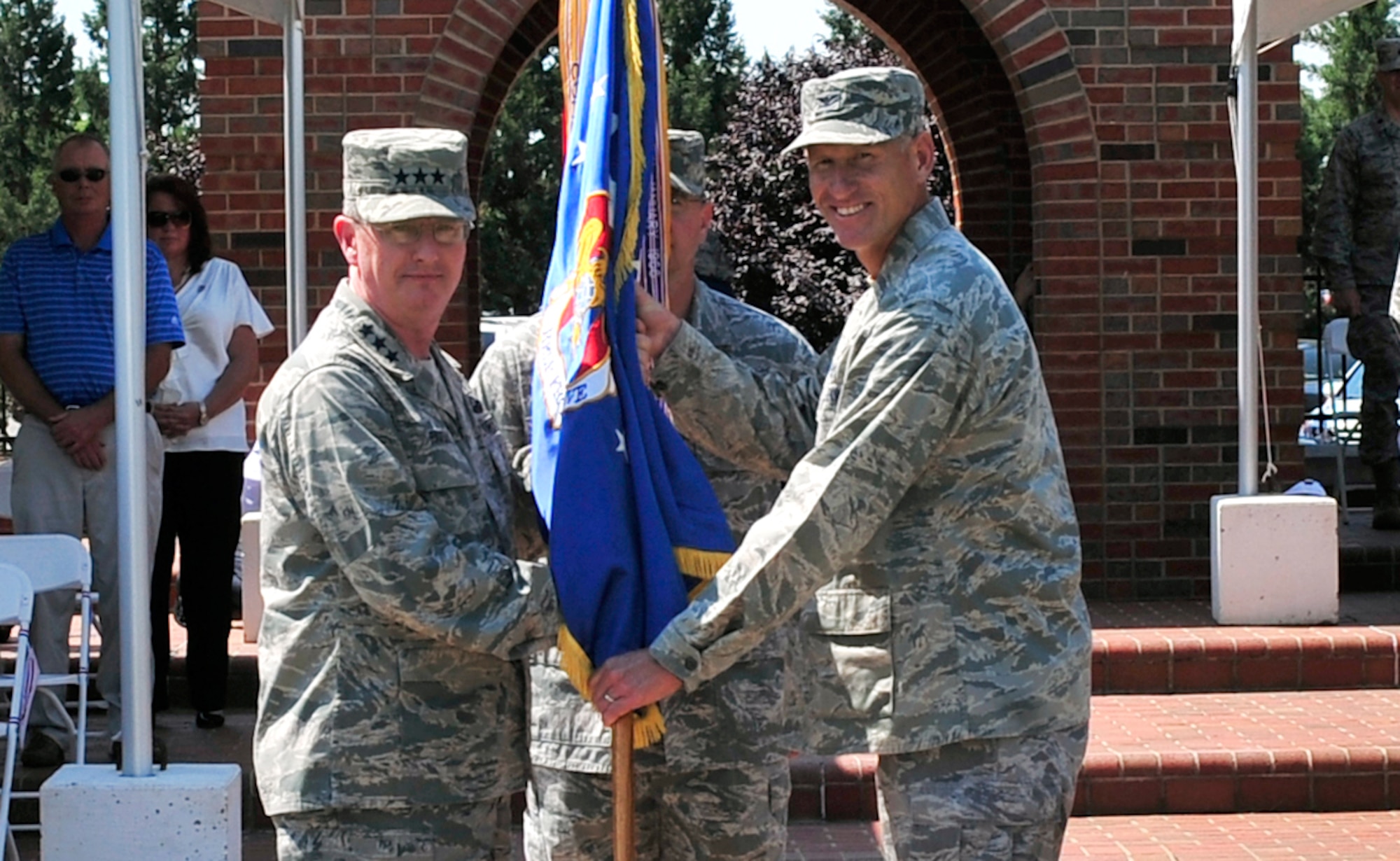 Lieutenant Gen. Mark Ramsey,18th Air Force commander, presents the 375th Air 
Mobility Wing flag to Col. David Almand signifying the start of Almand's 
command of the wing during a ceremony May 18 at Scott Air Force Base, Ill. 
Almand arrived from MacDill Air Force Base, Fla., where he served as the Vice 
Commander for the 6th Air Mobility Wing.  (U.S. Air Force photo/Staff Sgt. 
Stephenie Wade)

