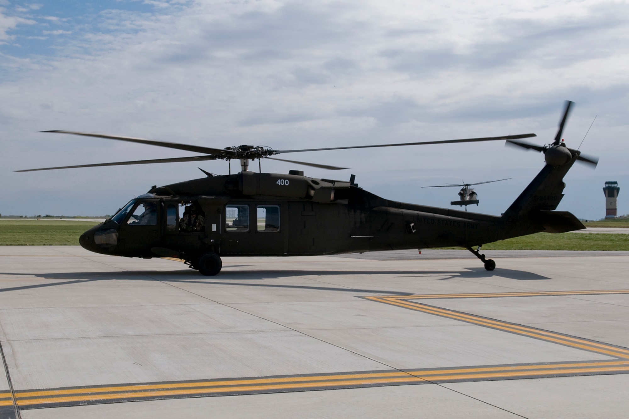 GRISSOM AIR RESERVE BASE, Ind. -- An Army National Guard UH-60 Black Hawk helicopter taxis to a refueling location at Grissom while another one touches down right behind it. The helicopters and their crews from the 2-238th General Support Aviation Battalion Medical Evacuation Unit trained at Grissom for two weeks to prepare for an upcoming deployment to Southwest Asia. (U.S. Air Force photo/Tech. Sgt. Mark R. W. Orders-Woempner)
