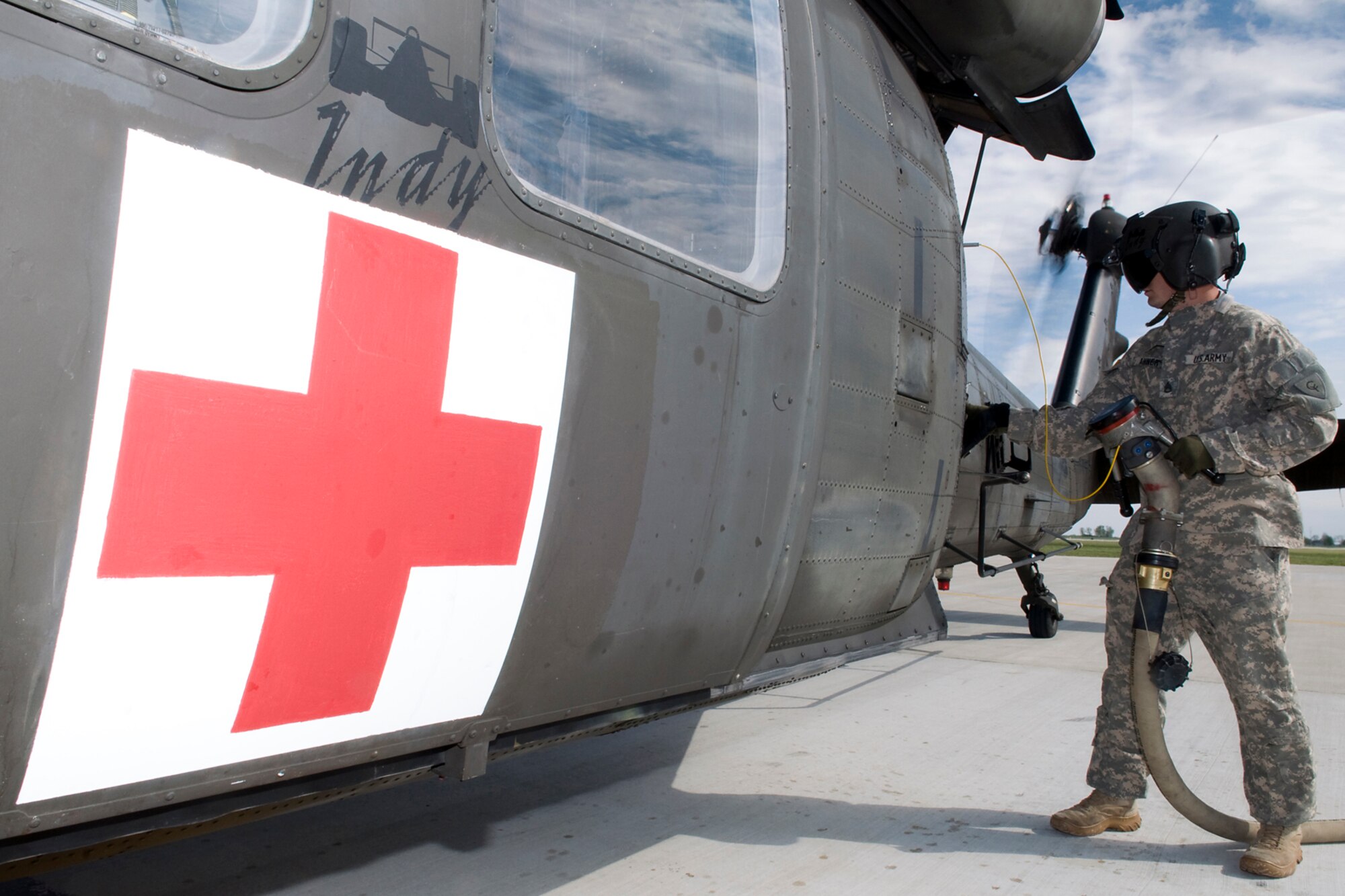 GRISSOM AIR RESERVE BASE, Ind. -- Indiana Army National Guard Staff Sgt. Ray Ahner, 2-238th General Support Aviation Battalion Medical Evacuation Unit aviation refueler, refuels a UH-60 Black Hawk helicopters at Grissom April 24. The 2-238th MEDEVAC, a unit made of Indiana and Kentucky National Guardsmen, came to Grissom to train for an upcoming deployment to Southwest Asia. (U.S. Air Force photo/Tech. Sgt. Mark R. W. Orders-Woempner)
