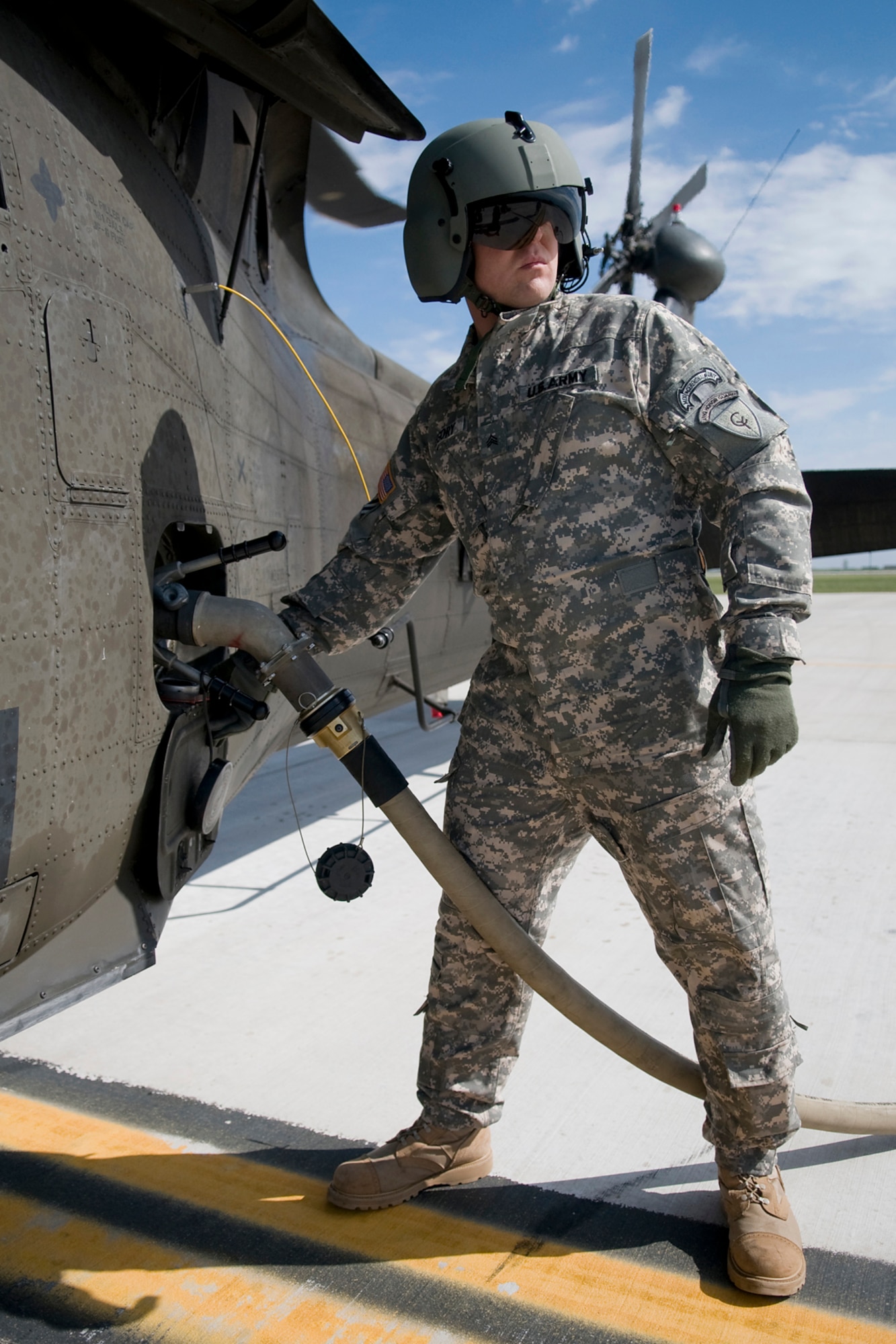 GRISSOM AIR RESERVE BASE, Ind. -- Army National Guard Sgt. Matthew Gregory, 2-238th General Support Aviation Battalion Medical Evacuation Unit aviation refueler, refuels a UH-60 Black Hawk helicopter at Grissom April 24. The 2-238th MEDEVAC came to Grissom to train for an upcoming deployment to Southwest Asia. (U.S. Air Force photo/Tech. Sgt. Mark R. W. Orders-Woempner)
