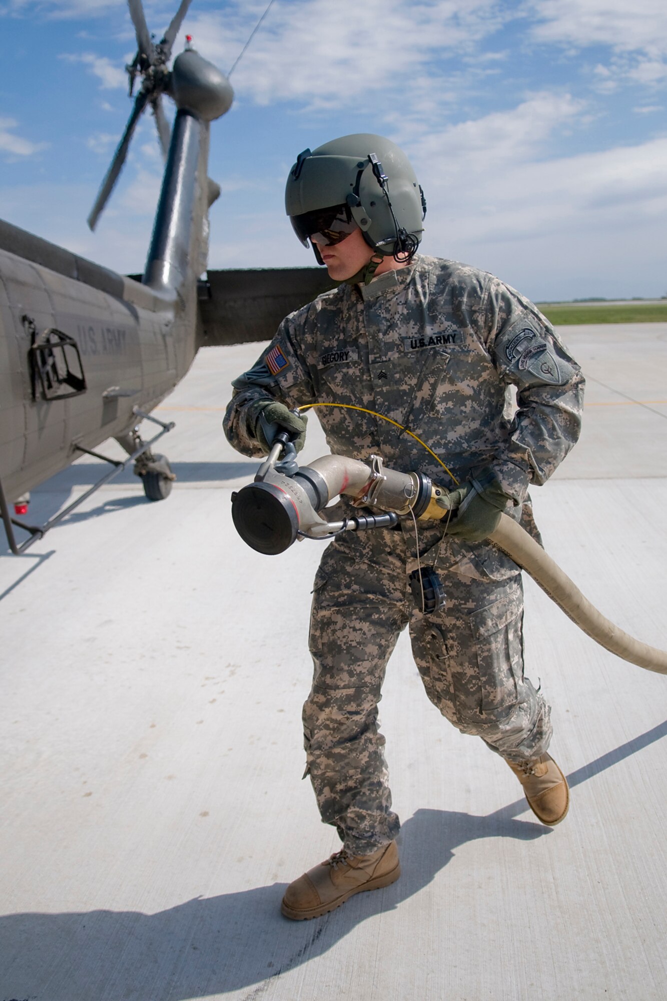 GRISSOM AIR RESERVE BASE, Ind. -- Army National Guard Sgt. Matthew Gregory, 2-238th General Support Aviation Battalion Medical Evacuation Unit aviation refueler, refuels a UH-60 Black Hawk helicopter at Grissom April 24. The 2-238th MEDEVAC came to Grissom to train for an upcoming deployment to Southwest Asia. (U.S. Air Force photo/Tech. Sgt. Mark R. W. Orders-Woempner)
