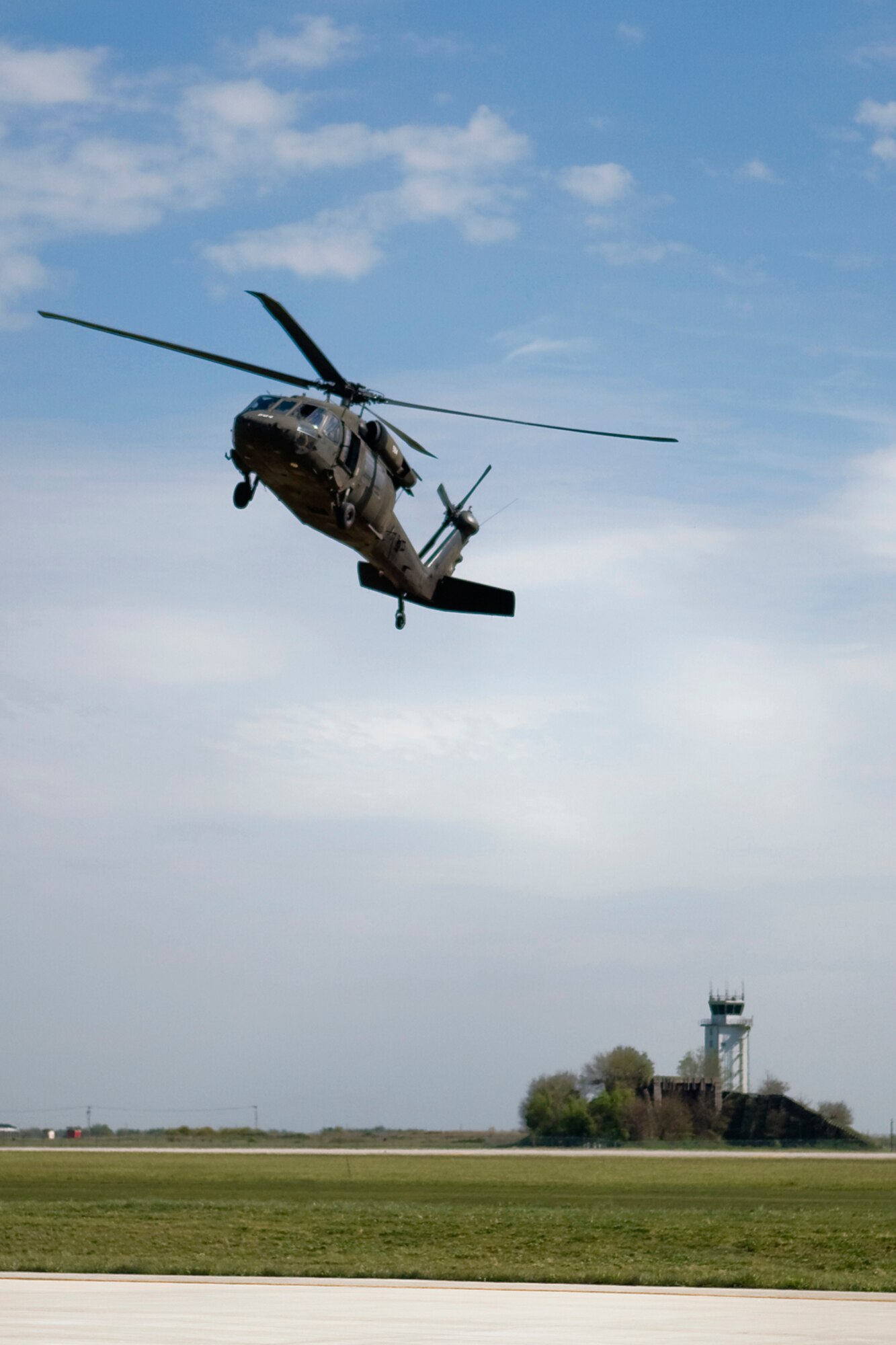 GRISSOM AIR RESERVE BASE, Ind. -- An Army National Guard UH-60 Black Hawk helicopter takes off after refueling at Grissom during predeployment training April 24. Helicopters and crews from the 2-238th General Support Aviation Battalion Medical Evacuation Unit trained at Grissom for two weeks to prepare for an upcoming deployment to Southwest Asia. (U.S. Air Force photo/Tech. Sgt. Mark R. W. Orders-Woempner)
