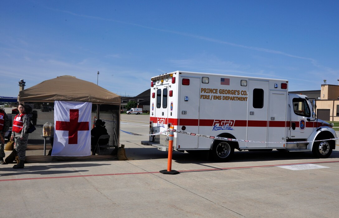 An ambulance and first-aid tent stand at each corner of the Joint Base Andrews flightline May 18 – 20 during the 2012 Joint Service Open House and Air Show. The 2012 JSOH and Air Show affords the public an opportunity to meet the men and women of the Armed Forces and to see military equipment through the efforts of active duty, Guard and Reserve service members, as well as civilian employees, retirees and family members. All JSOH attendees, whether they are a performer, volunteer or JSOH visitor, are allowed to utilize these comfort stations during their time on the Andrews flightline. (U.S. Air Force photo/Senior Airman Lindsey A. Porter)