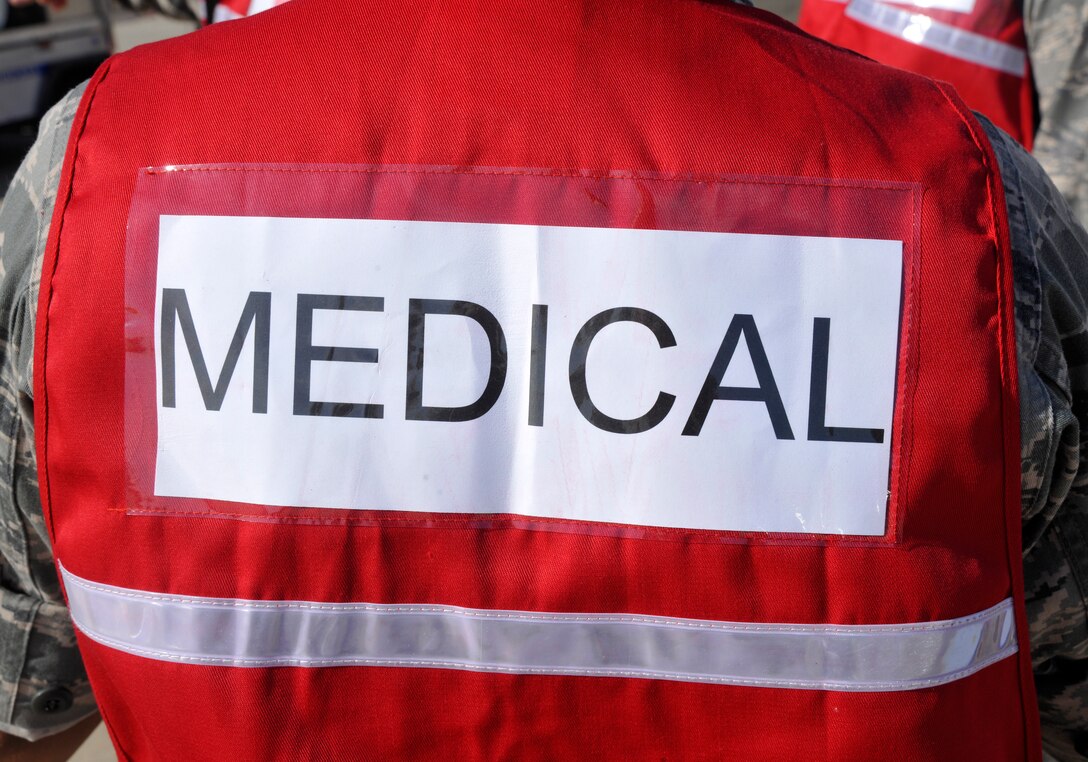 2012 Joint Service Open House and Air Show medics and first-aid station technicians wear bright red medic vests during Joint Base Andrews’ air show weekend, May 18 - 20. Air Show patrons may ask any red-vested attendant or visit one of four flightline comfort stations for help with any medical need throughout the weekend. (U.S. Air Force photo/Senior Airman Lindsey A. Porter)