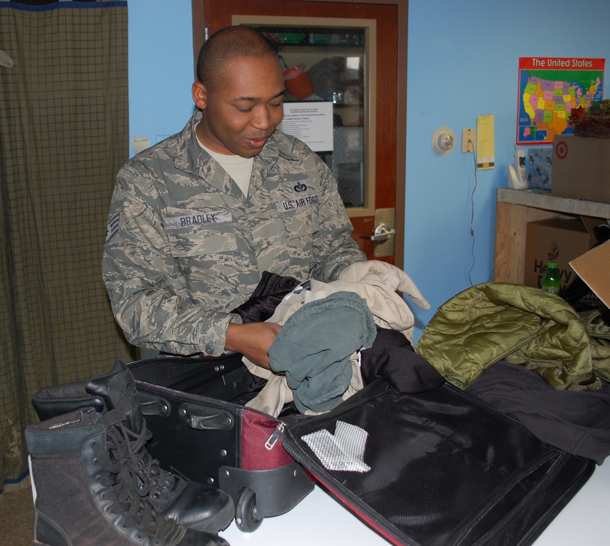 Staff Sgt. Nathaniel Bradley, 341st Civil Engineer Squadron HVAC journeyman, sorts through donations at the Airman's Attic May 3. (U.S. Air Force photo/Senior Airman Kristina Overton)
