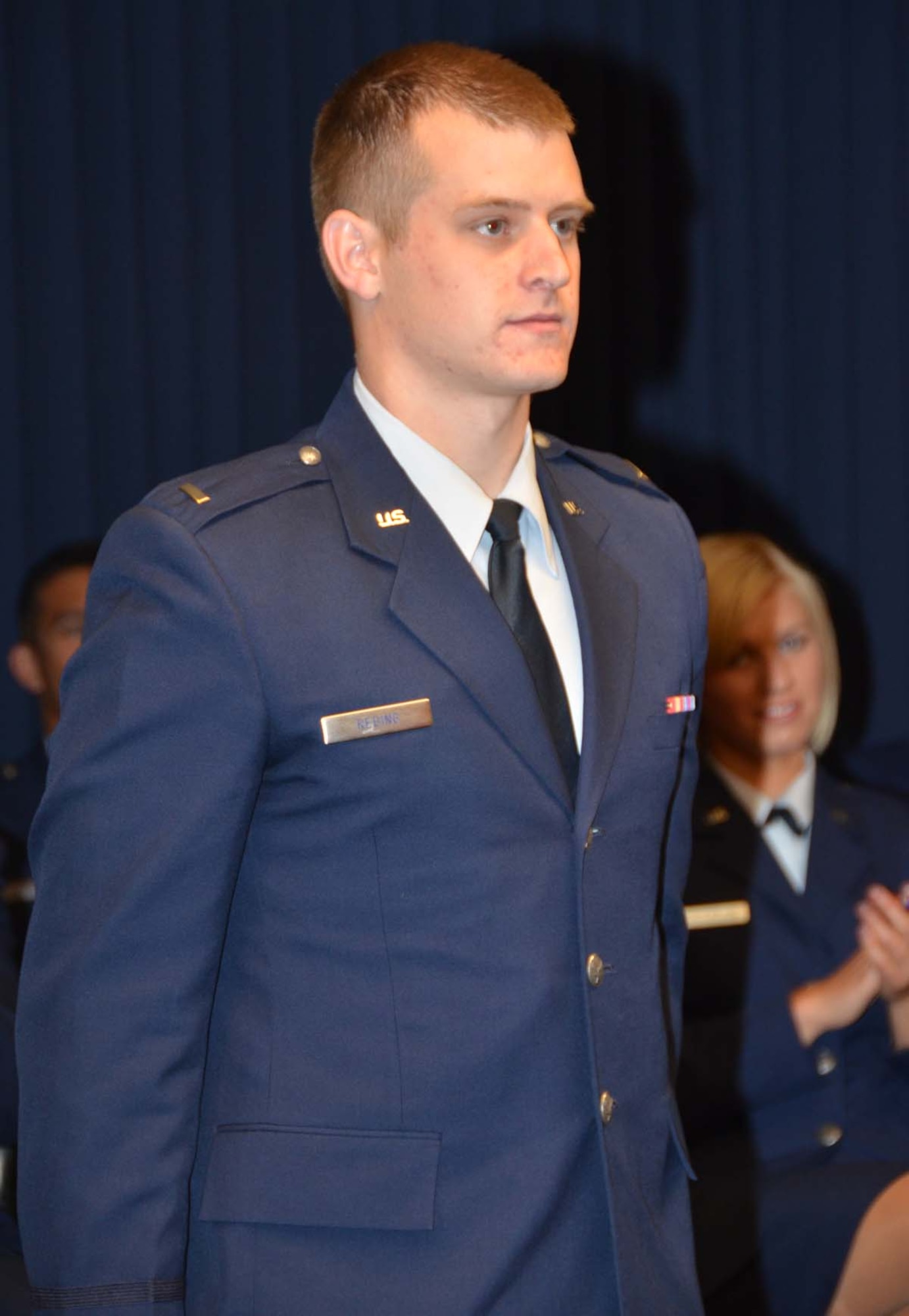 Newly commissioned 2nd Lt. Joshua Reding is formally presented to attendees of the May 11, 2012 University of New Mexico Air Force ROTC commissioning ceremony held at the Air Force Operational Test and Evaluation Center at Kirtland AFB, N.M.