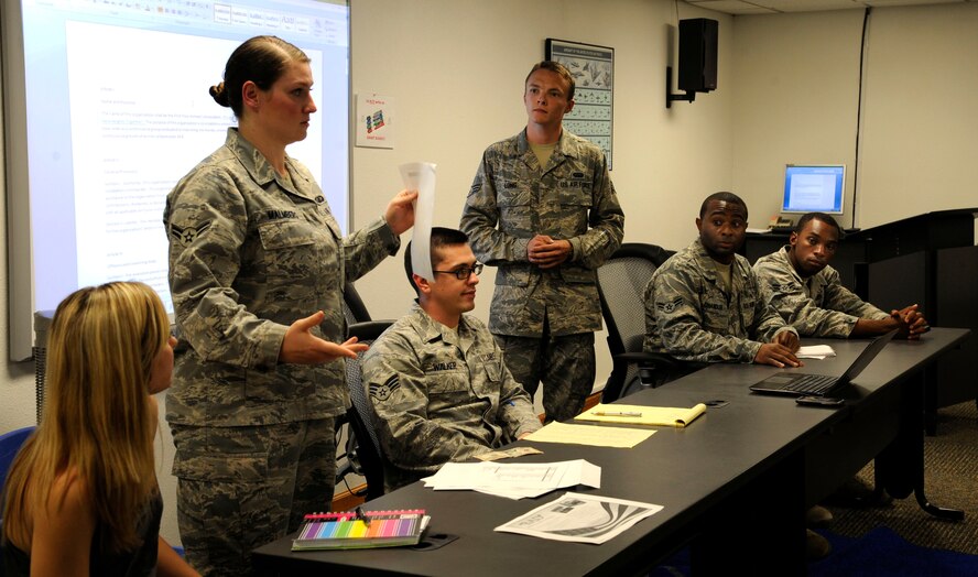 Leaders of the First Four Airmen's Association present valuable information to members at Hoban Hall on Barksdale Air Force Base, La., May 15. The association's monthly meetings allow the group to discuss upcoming volunteer and fundraising opportunities. Recently, the group coordinated more than 50 Airmen volunteers to help the 307th Bomb Wing prepare its new recruits for Basic Military Training. (U.S. Air Force photo/Airman 1st Class Andrew Moua) (RELEASED)