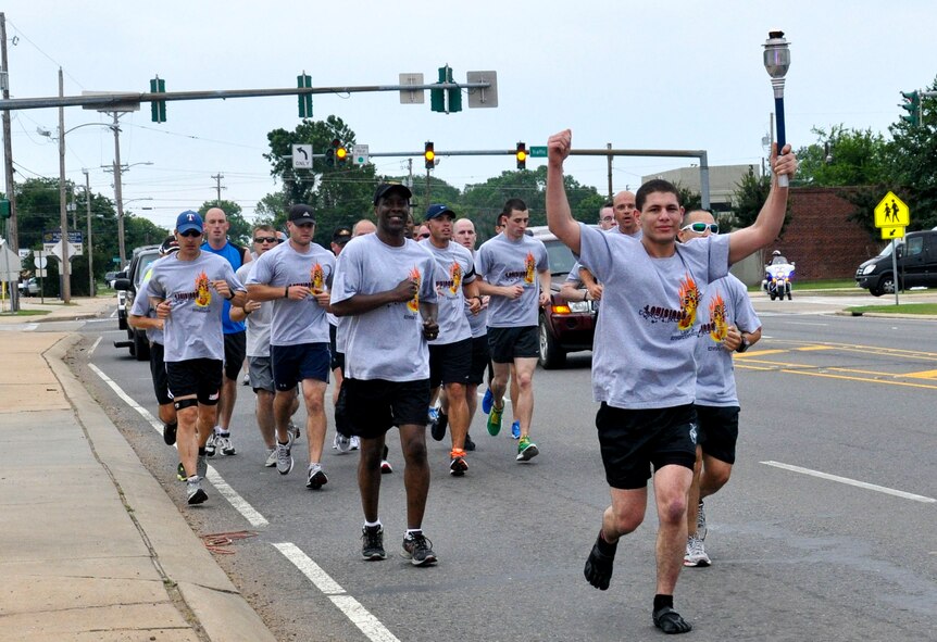 Airman 1st Class Clayton Wilson, 2nd Security Forces Squadron, leads the way for the Bossier City Leg of the Law Enforcement Torch Run May 11.  Wilson joined more than 40 other runners from area law enforcement agencies to make the three-mile run from the Bossier Civic Center to the Caddo Parish Courthouse in support of Special Olympics and Police Week. Runners from Northwest Louisiana will continue to trek south passing the torch to other law enforcement officers as they make their way to the opening ceremonies of the 2012 State Summer Games for the Special Olympics. (Courtesy photo)