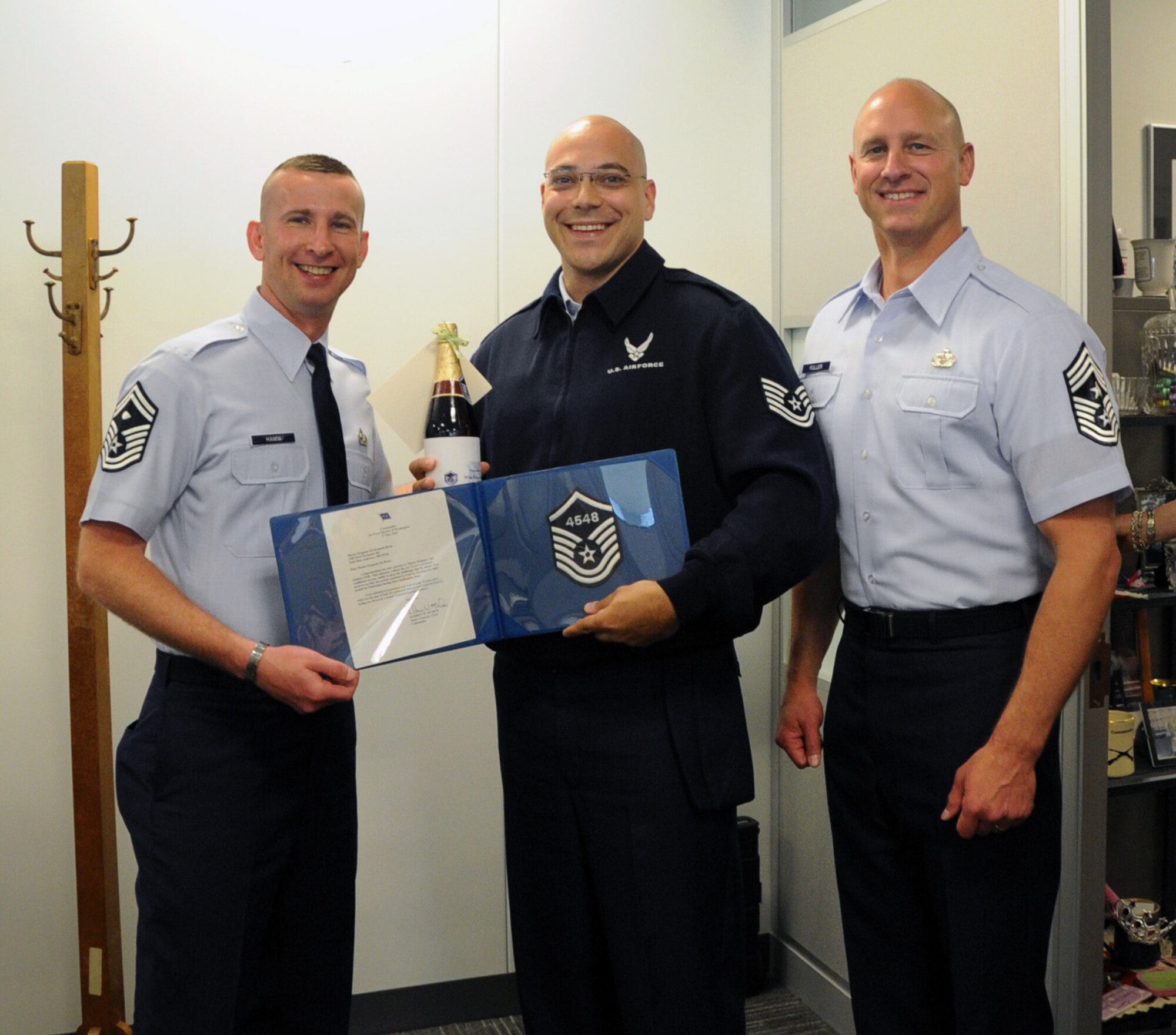 Master Sgt. select Kenneth Boria, Air Force District of Washington protocol, celebrates his achievement May 17 with AFDW Vice Commander Col. Jeffrey L. Stephenson on Joint Base Andrews, Md. The AFDW senior leaders congratulated each selected technical sergeant for their achievement.  AFDW gained six new senior NCOs from the 5,464 technical sergeants selected for promotion to master sergeant. (U.S. Air Force photo by Airman 1st Class Tabitha N. Haynes)