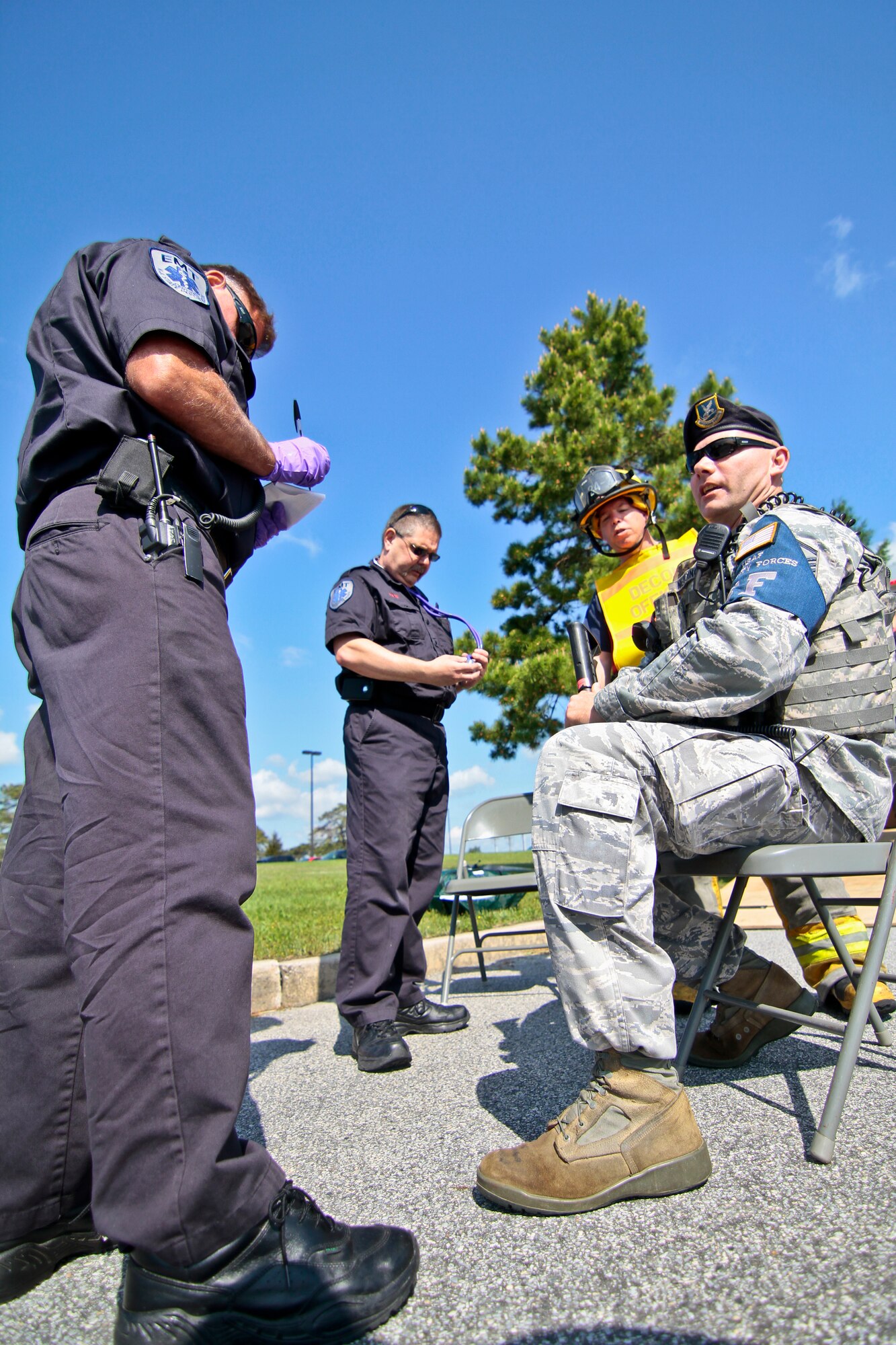 A picture of New Jersey Air National Guardsman Master Sgt. Donald Meddings being checked out by Emergency Medical Technicians.