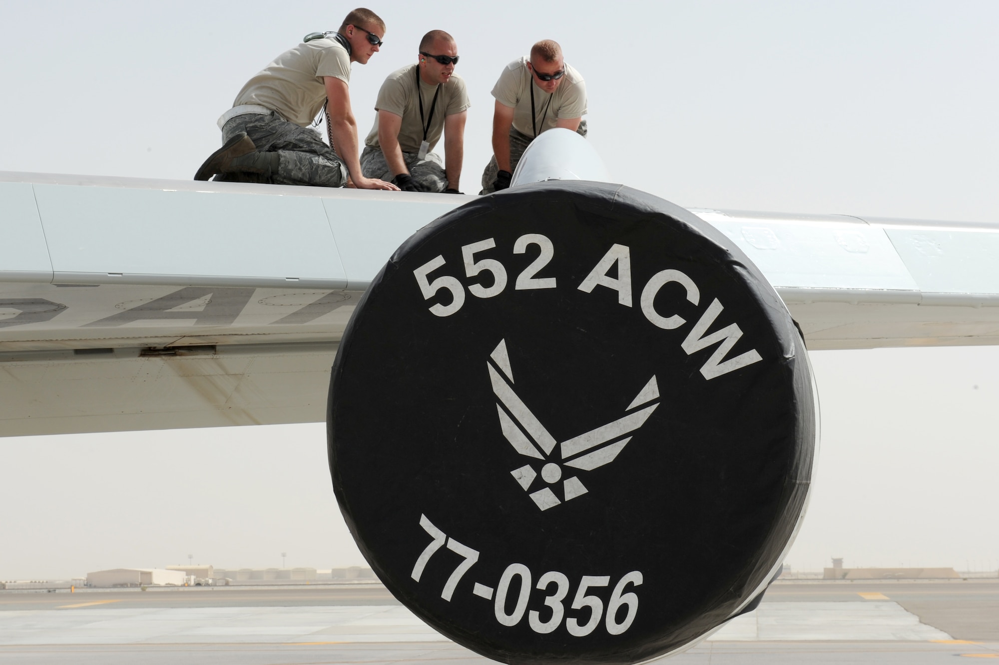 SOUTHWEST ASIA -- Maintainers from Tinker Air Force Base, Okla., perform maintenance on the wing of an E-3 Sentry May 17, 2012. The aircraft is an airborne warning and control system that provides an accurate, real-time picture of the battlespace. (U.S. Air Force photo/ Master Sgt. Scott MacKay)