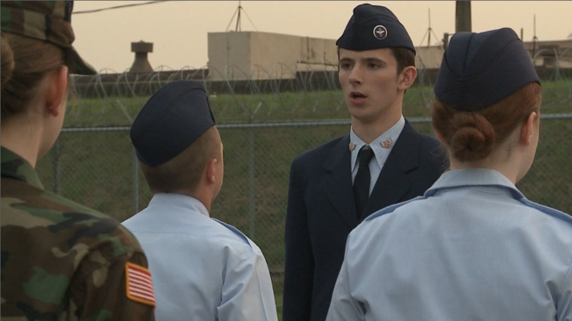 Cadet Staff Sgt. James McGovern orders a formation of cadets to stand at attention May, 7, 2012, at Osan Air Base, Republic of Korea. McGovern relinquished command to Cadet Technical Sergeant Olivia Nail. (U.S. Air Force photo/Staff Sgt. Gena Armstrong)