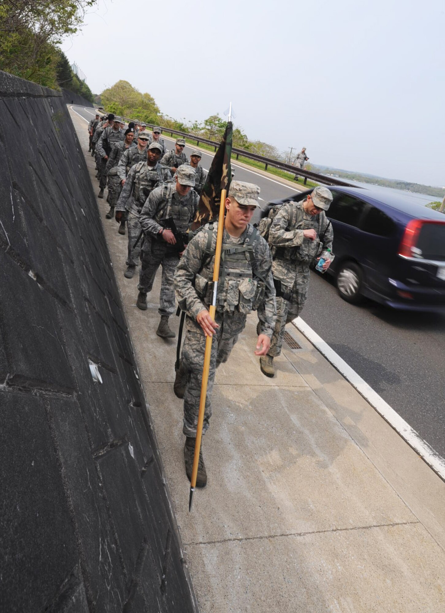 U.S. Airmen from the 35th Security Forces Squadron march down concrete canyon to remember police officers who died in line of duty during National Police Week at Misawa Air Base, Japan, May 18, 2012. The march helped give global recognition to fallen or injured police officers and law enforcers who embody the Air Force core competency, “service before self.” (U.S. Air Force photo by Airman Kenna Jackson/Released)