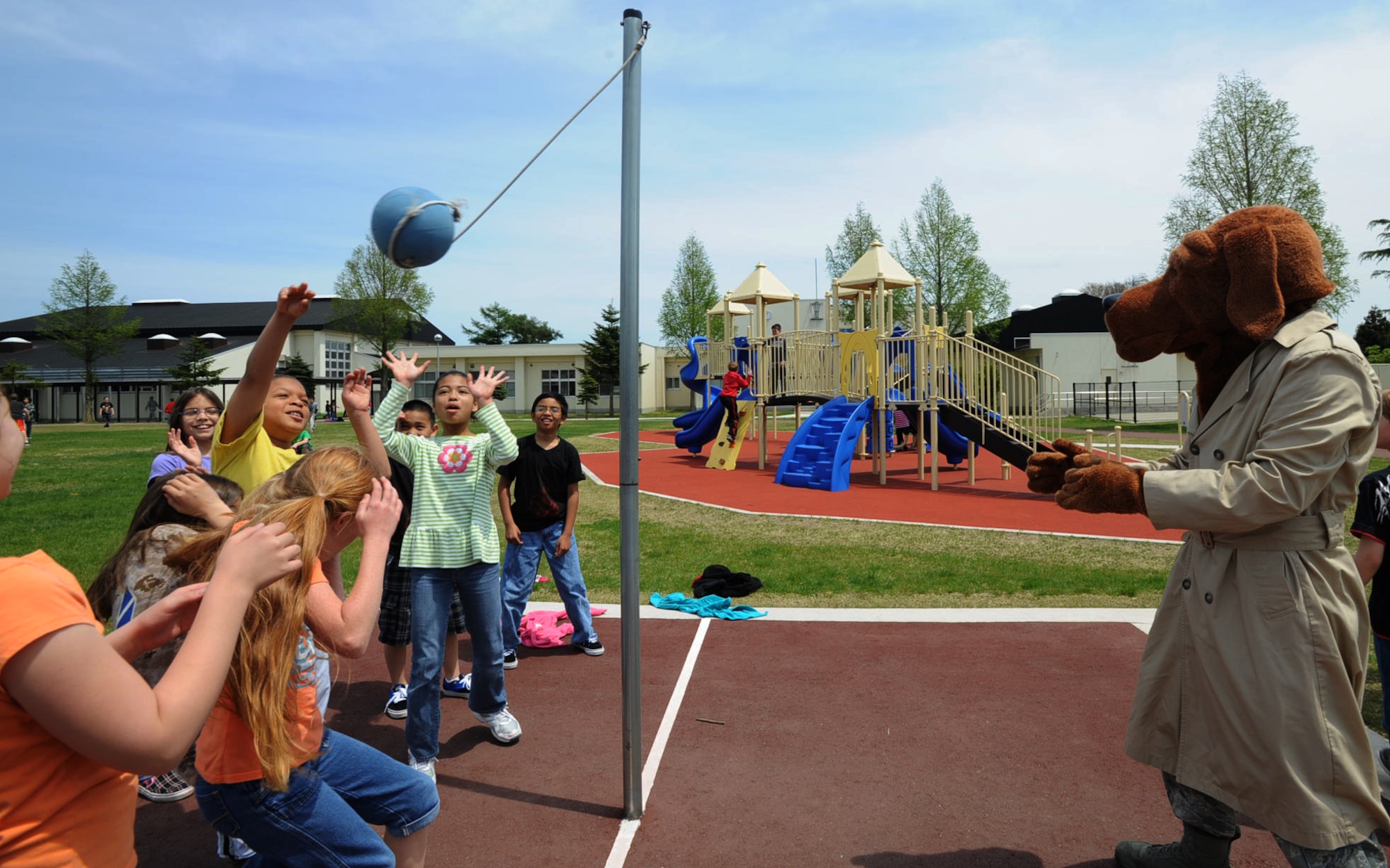 On the second day of National Police Week, a group of Sollars Elementary School students play tetherball with McGruff the Crime Dog during recess at Misawa Air Base, Japan, May 14, 2012. National Police Week began in 1982, and has since brought thousands of survivors and law enforcement officers to Washington D.C. to celebrate Peace Officer Memorial Day every year. (U.S. Air Force photo by Airman Kenna Jackson/Released)