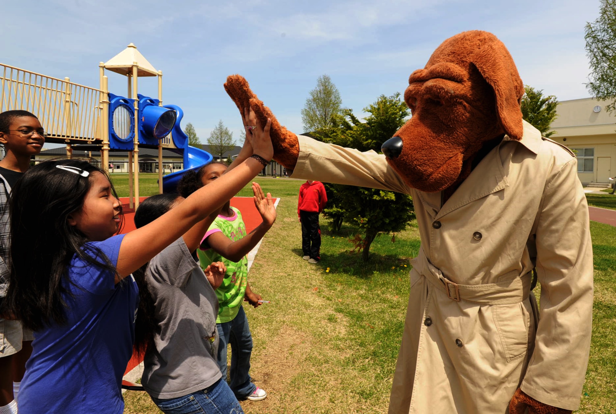 McGruff the Crime Dog hangs out with Sollars Elementary School students during recess in support of National Police Week at Misawa Air Base, Japan, May 14, 2012. National Police Week honors police officers who have paid the ultimate sacrifice. (U.S. Air Force photo by Airman Kenna Jackson/Released)