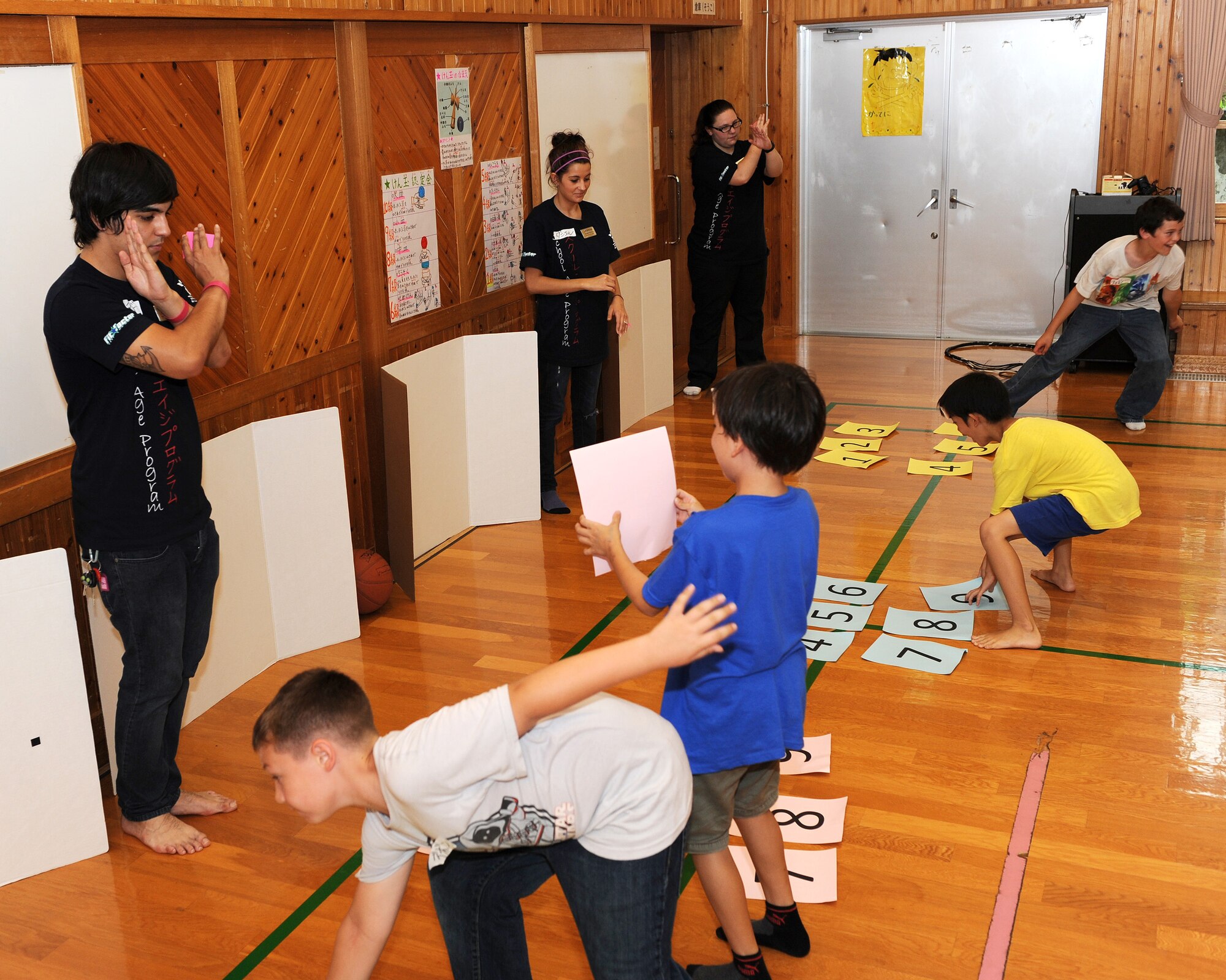 Children from Kadena’s School Age Program play a combination game during the inaugural children’s exchange program at Kitatama Children's Center in Chatan, Okinawa, Japan, May 16, 2012. Children from Kadena Air Base and KCC had fun interacting with each other and playing games in the cultural exchange.  (U.S. Air Force photo/Junko Kinjo)