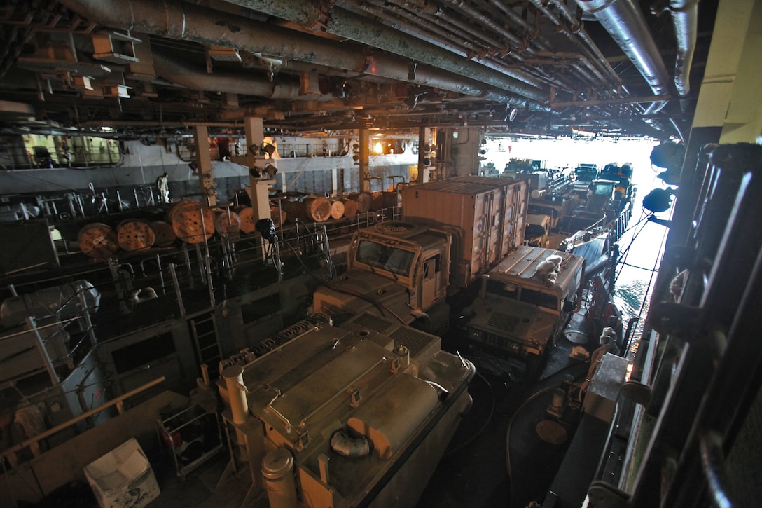 Landing Craft Utilities are loaded into the well deck of the USS Peleliu, July 18, during Composite Unit Training Exercise (COMPTUEX) 2012. The pre-deployment exercise will evaluate the ARG’s ability to conduct integrated military operations and support the 15th Marine Expeditionary Unit as it conducts training operations at sea and ashore in a realistic training environment.