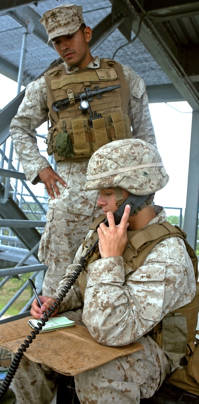 Cpl. Benjamin Leo, (right), speaks with Lance Cpl. William Johnson, both combat engineers with 1st Platoon, Alpha Company, 9th Engineer Support Battalion, 1st Marine Logistics Group (Forward), after completing a day of engineering operations at Forward Operating Base Shukvani, Afghanistan, May 18. Since arriving in November, the Marines with Alpha Co. have completed various engineering projects throughout Helmand Province.