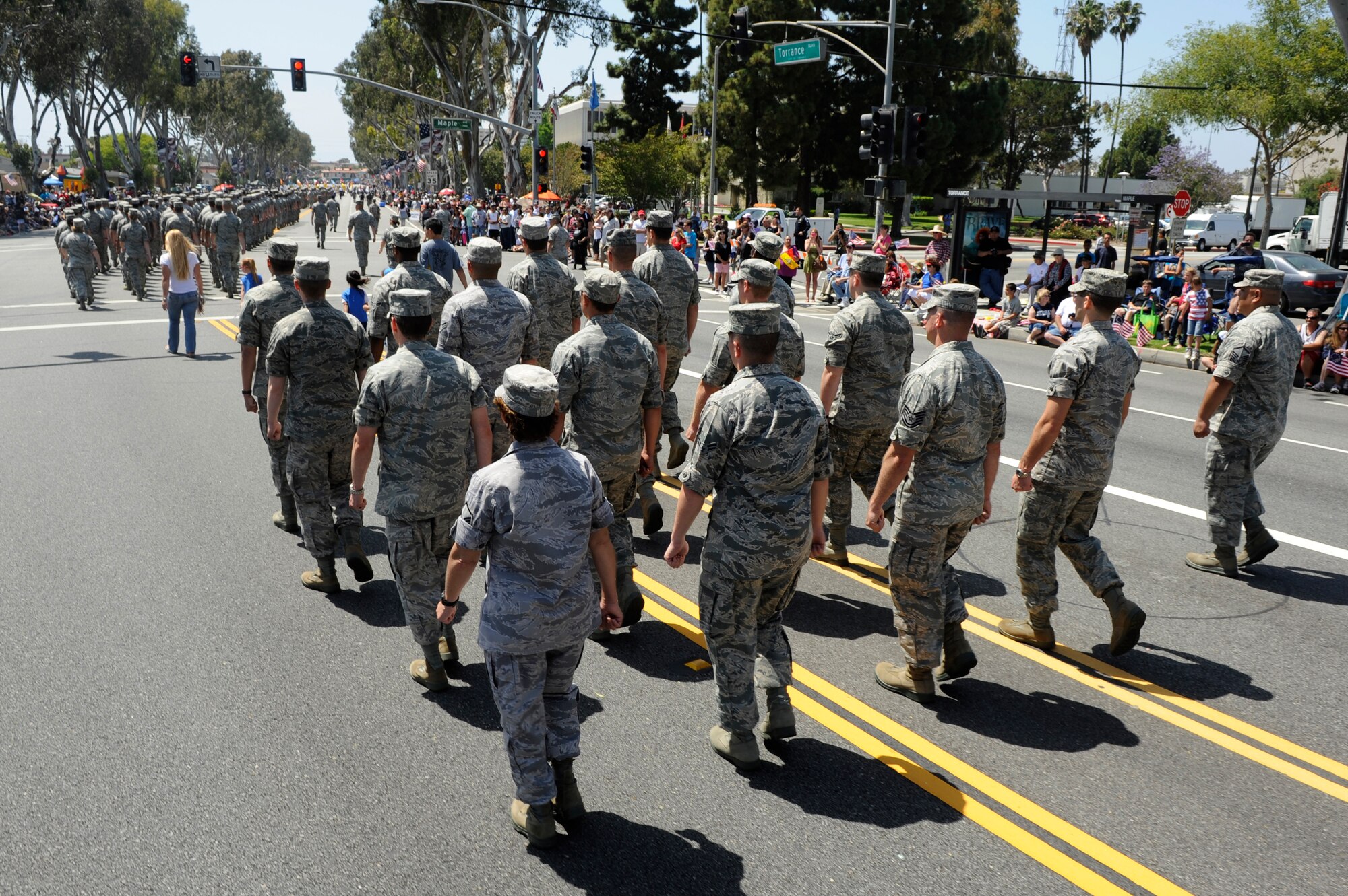 TORRANCE, Calif. -- Team V Airmen march during the 53rd Annual Armed Forces Day Parade here Saturday, May 19, 2012. Approximately 325 Airmen from Vandenberg Air Force Base, Los Angeles AFB and Edwards AFB marched in the parade of more than 100,000 onlookers. (U.S. Air Force photo/Staff Sgt. Levi Riendeau)
