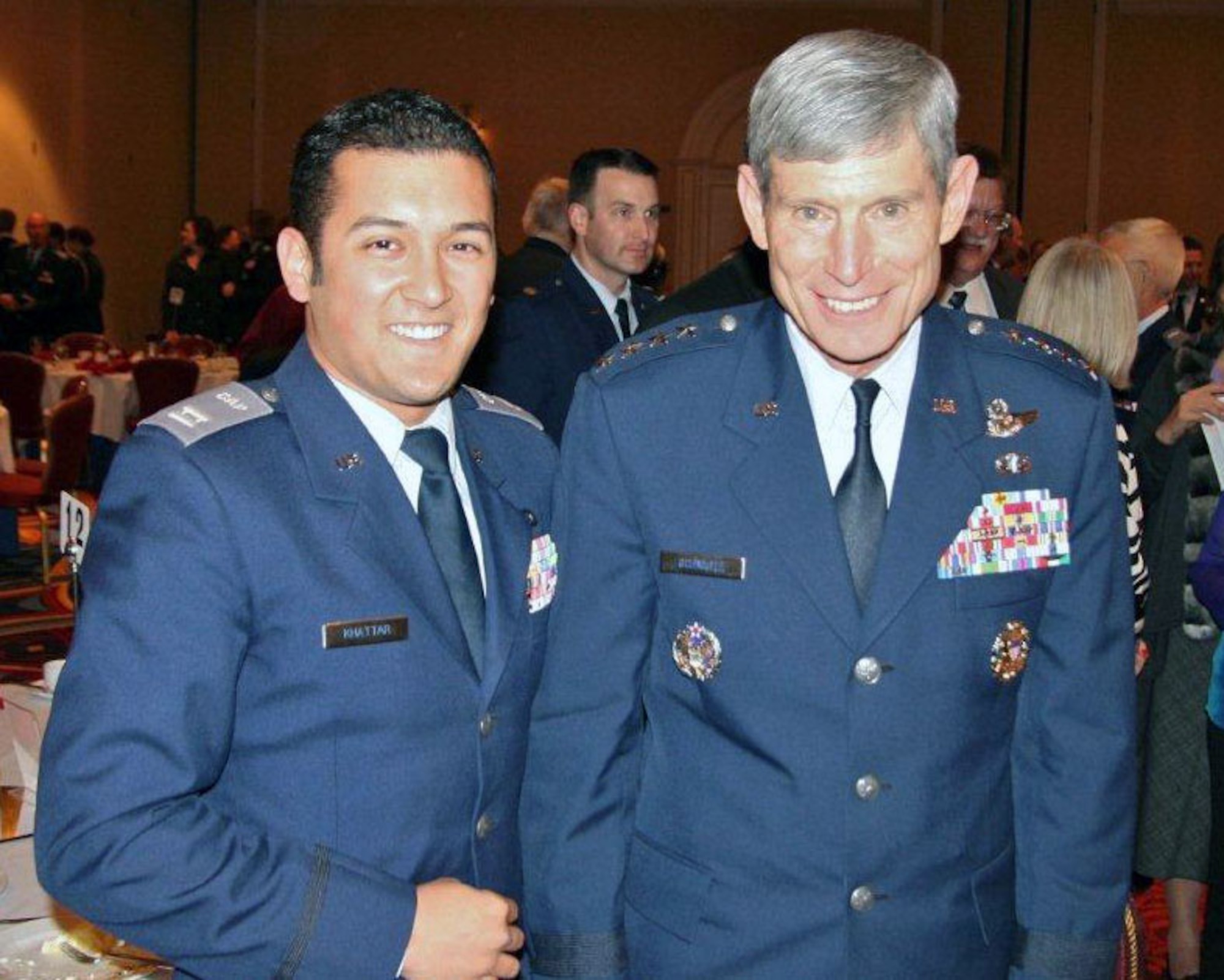 Civil Air Patrol Captain Jonathan Khattar poses with Maj. Gen. Schwartz at the Spaatz Association Annual Banquet held in Washinton D.C. Khattar is also a Senior Airman with the 146th Airlift Wing, working in Command Post. Photograph submitted by Senior Airman Jonathan Khattar. 
