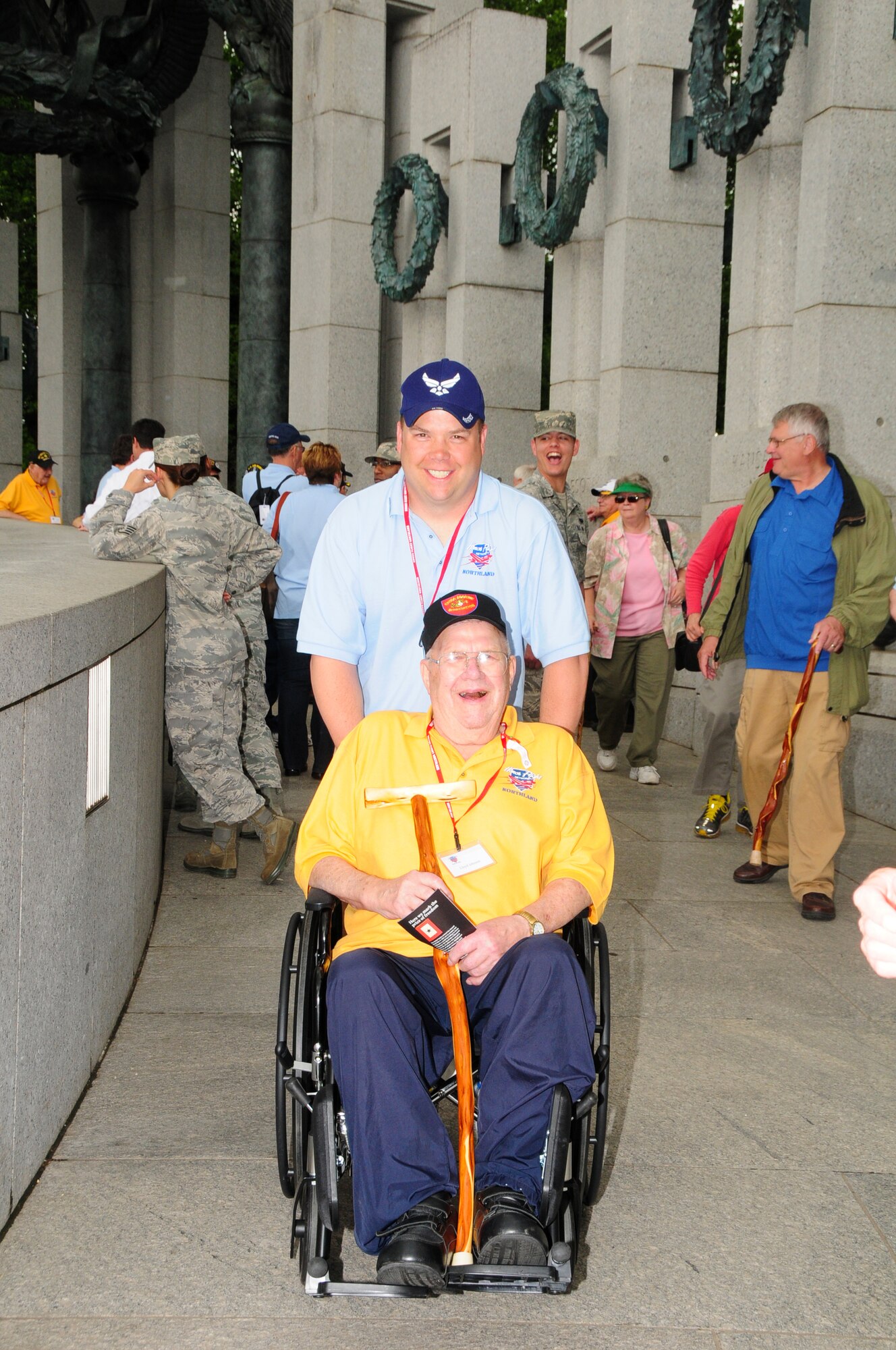 148th Fighter Wing member Senior Master Sgt. Kyle A. Johnson poses for a photo with his father Lloyd O. Johnson Tuesday May 15, 2012 at the World War II Memorial in Washington D.C.  85 veterans from northern Minnesota and Wisconsin took part in the third honor flight out of Duluth, Minn. (National Guard photo by Tech. Sgt. Scott G. Herrington.)