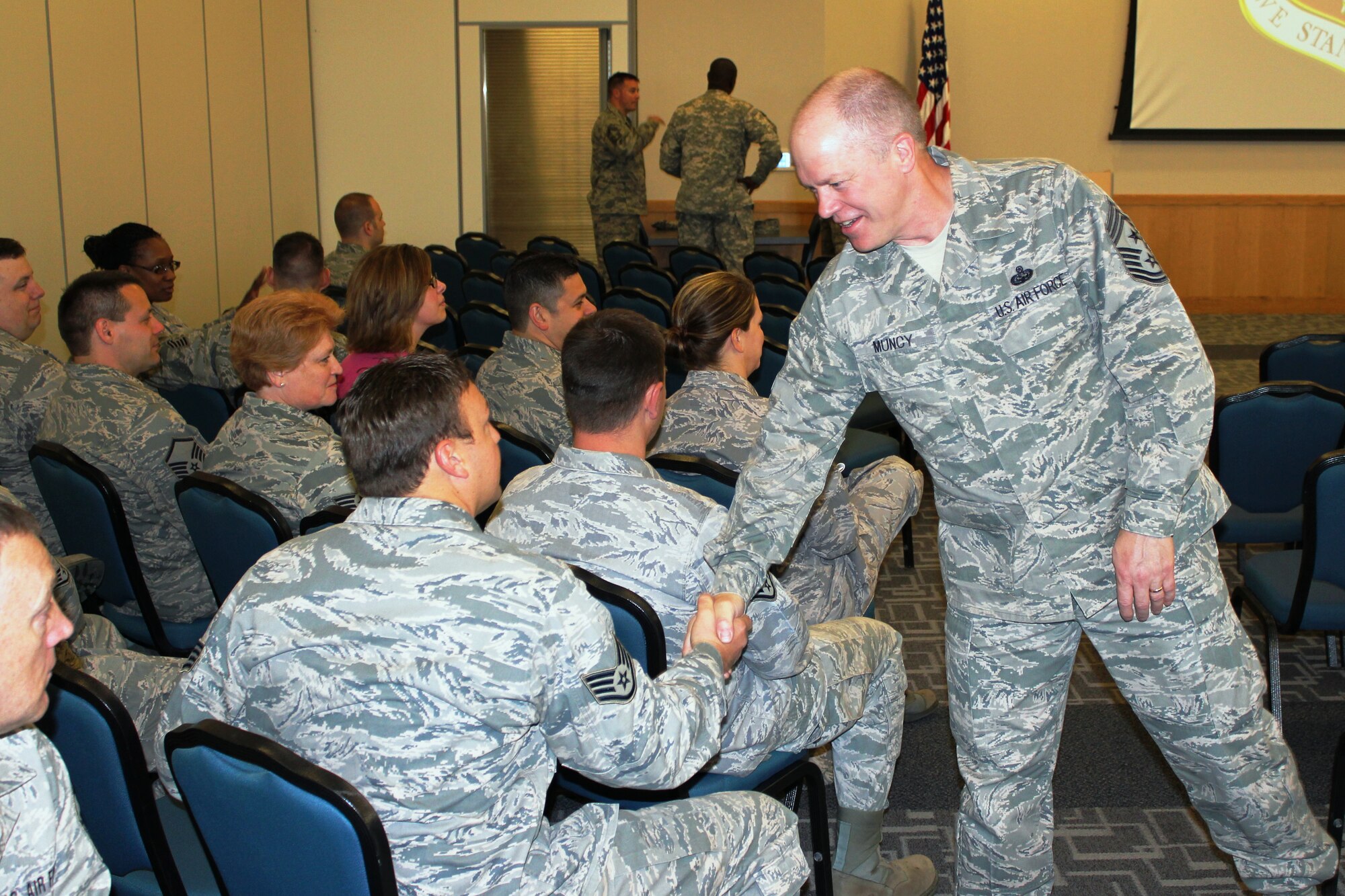 Chief Master Sgt. Christopher Muncy shakes hands with members of the 127th Wing at Selfridge Air National Guard Base, Mich., May 19, 2012. Muncy is the command chief for the Air National Guard. He was visiting ANG facilities in Michigan during the May Unit Training Assembly, when members of the Air Guard report for duty at their respective training locations. (U.S. Air Force photo by TSgt. Dan Heaton)