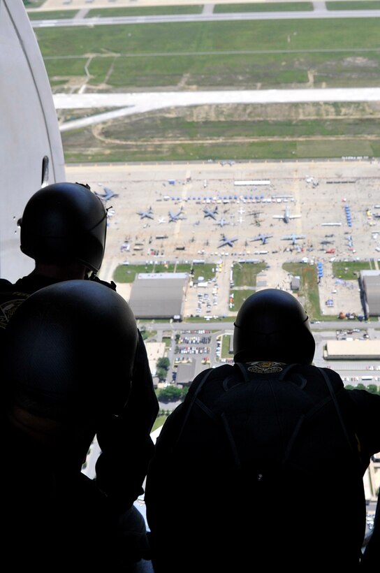 The Golden Knights prepare to exit the aircraft during the Joint Service Open House, May 18, 2012, at Joint Base Andrews, Md. This year's Joint Service Open House celebrates the Centennial of Marine Corps Aviation. JSOH affords the public an opportunity to meet the men and women of the Armed Forces while viewing over 100 static displays and 19 aerial demonstration teams. (U.S. Air Force photo by Senior Airman Perry Aston)