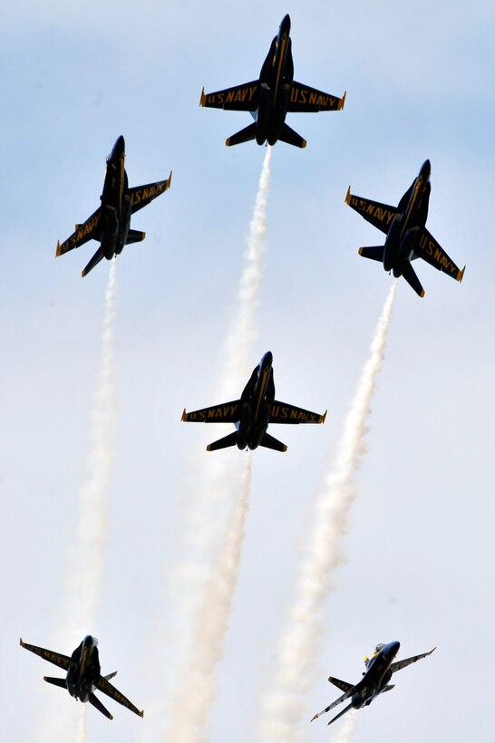 The United States Navy Blue Angels demonstration team performs during the Joint Service Open House, May 18, 2012, at Joint Base Andrews, Md. This year's Joint Service Open House celebrates the Centennial of Marine Corps Aviation. JSOH affords the public and opportunity to meet the men and women of the Armed Forces while viewing over 100 static displays and 19 aerial demonstration teams. (U.S. Air Force photo by Senior Airman Perry Aston)