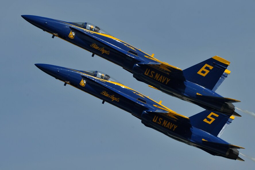 The United States Navy Blue Angels demonstration team performs during the Joint Service Open House, May 18, 2012, at Joint Base Andrews, Md. This year's Joint Service Open House celebrates the Centennial of Marine Corps Aviation. JSOH affords the public an opportunity to meet the men and women of the Armed Forces while viewing over 100 static displays and 19 aerial demonstration teams. (U.S. Air Force photo by Senior Airman Perry Aston) 
