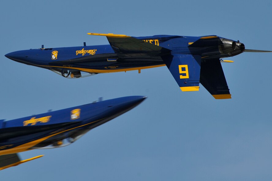 The United States Navy Blue Angels demonstration team performs during the Joint Service Open House, May 18, 2012, at Joint Base Andrews, Md. This year's Joint Service Open House celebrates the Centennial of Marine Corps Aviation. JSOH affords the public an opportunity to meet the men and women of the Armed Forces while viewing over 100 static displays and 19 aerial demonstration teams. (U.S. Air Force photo by Senior Airman Perry Aston) 
