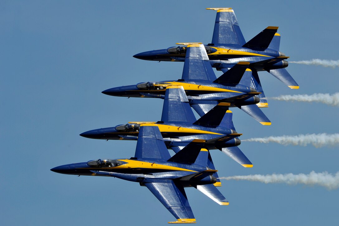 The United States Navy Blue Angels demonstration team performs during the Joint Service Open House, May 18, 2012, at Joint Base Andrews, Md. This year's Joint Service Open House celebrates the Centennial of Marine Corps Aviation. JSOH affords the public an opportunity to meet the men and women of the Armed Forces while viewing over 100 static displays and 19 aerial demonstration teams. (U.S. Air Force photo by Senior Airman Perry Aston)
