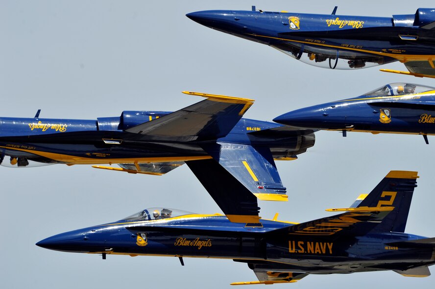 The United States Navy Blue Angels demonstration team performs during the Joint Service Open House, May 18, 2012, at Joint Base Andrews, Md. This year's Joint Service Open House celebrates the Centennial of Marine Corps Aviation. JSOH affords the public an opportunity to meet the men and women of the Armed Forces while viewing over 100 static displays and 19 aerial demonstration teams. (U.S. Air Force photo by Senior Airman Perry Aston) 
