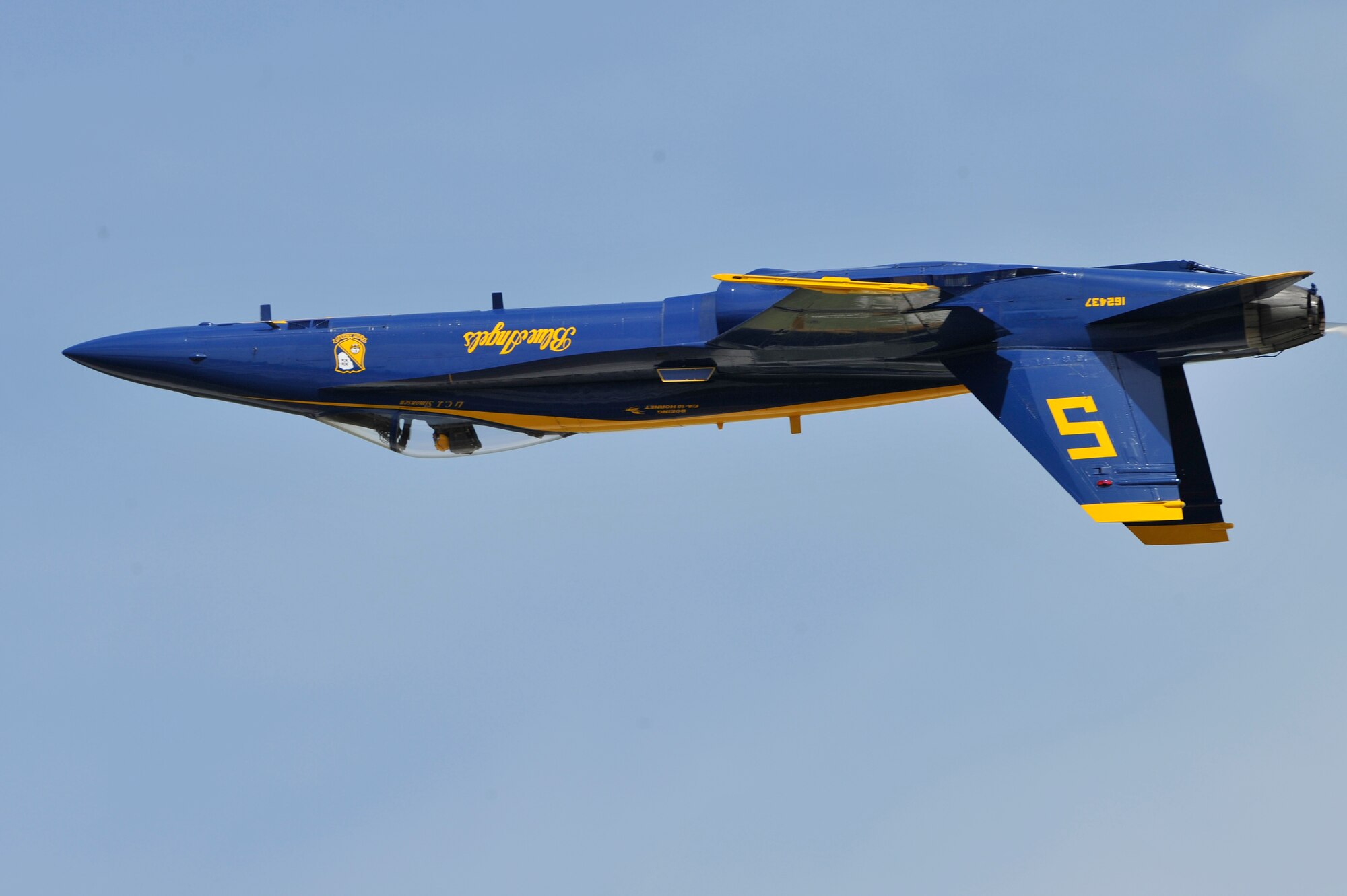 The United States Navy Blue Angels demonstration team performs during the Joint Service Open House, May 18, 2012, at Joint Base Andrews, Md. This year's Joint Service Open House celebrates the Centennial of Marine Corps Aviation. JSOH affords the public an opportunity to meet the men and women of the Armed Forces while viewing over 100 static displays and 19 aerial demonstration teams. (U.S. Air Force photo by Senior Airman Perry Aston)
