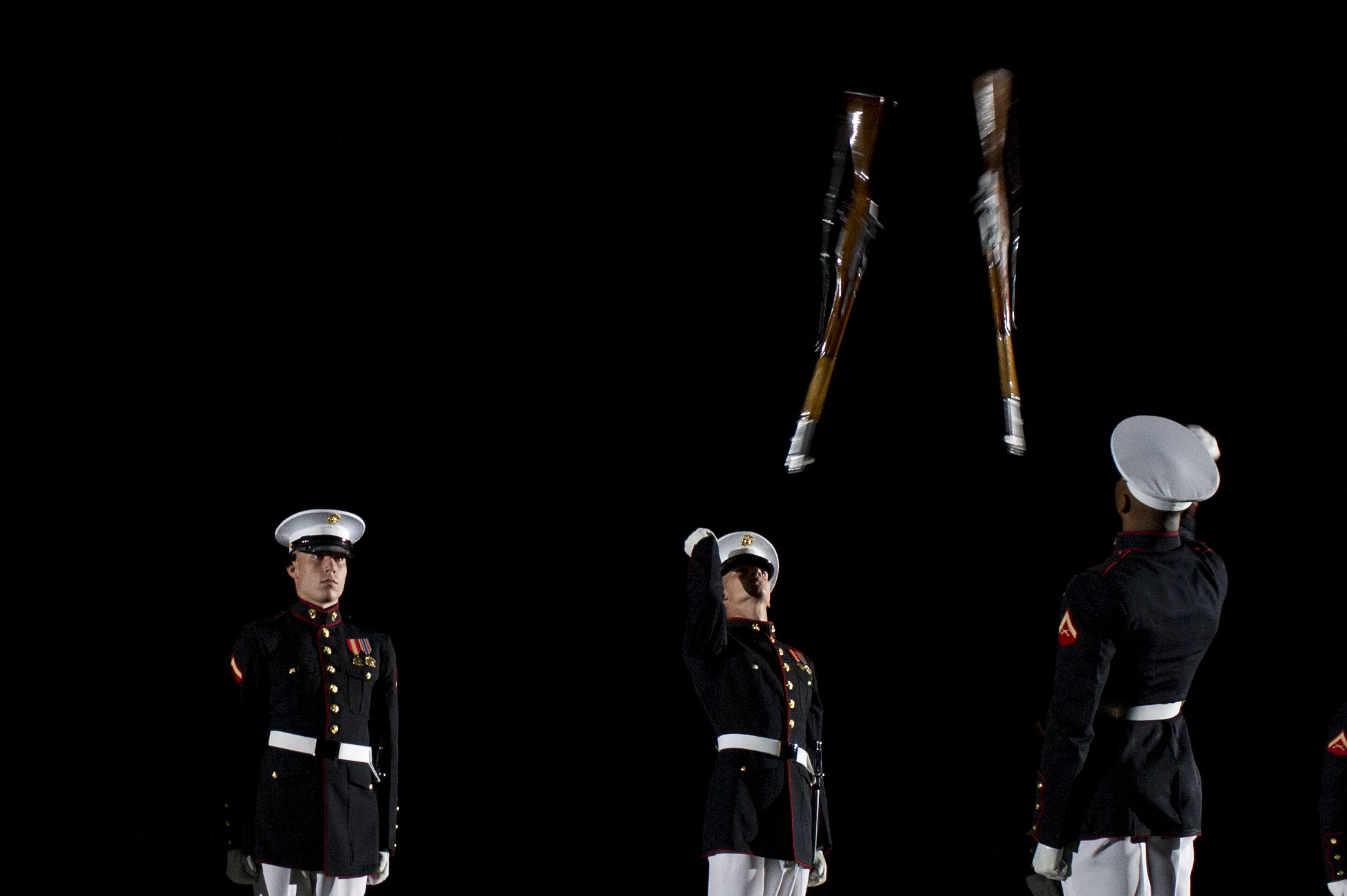 Members Of The Marine Corps Silent Drill Platoon Throw M1 Garand Rifles Into The Air During