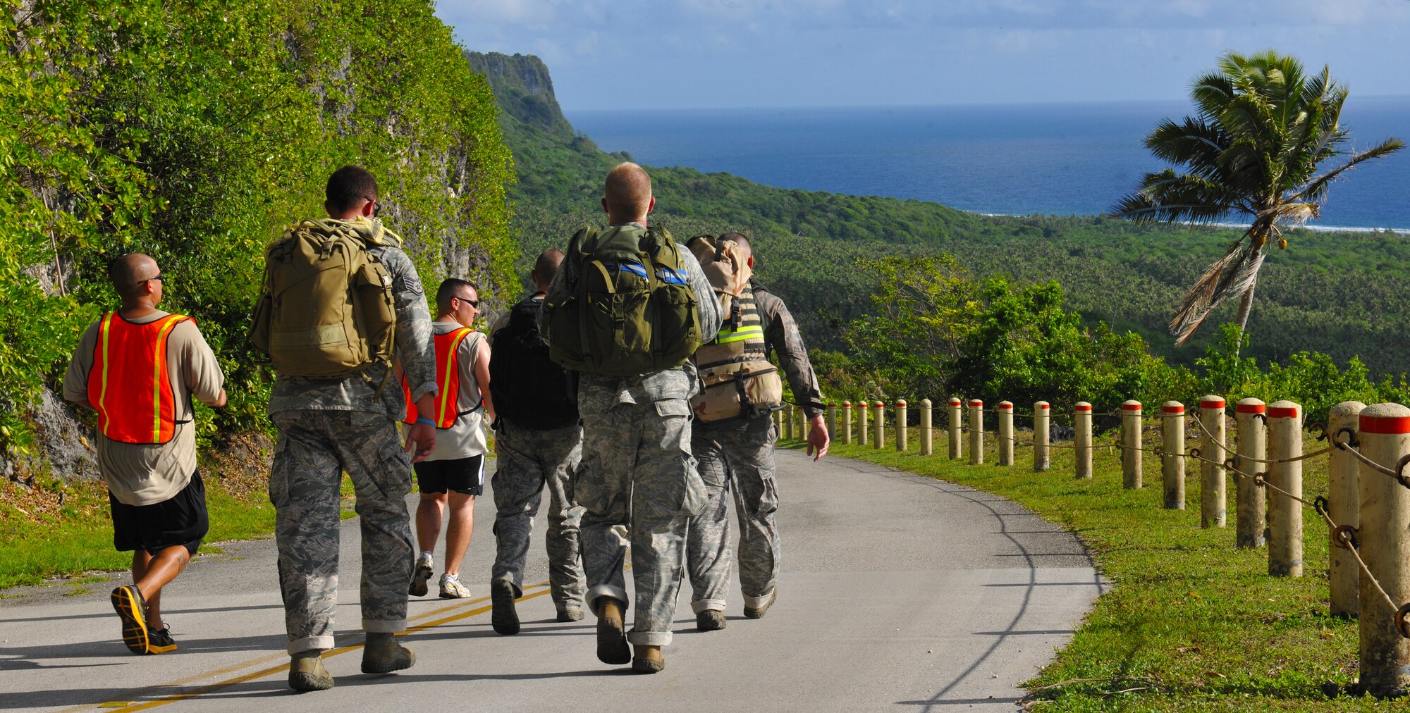 ANDERSEN AIR FORCE BASE, Guam— The 36th Security Forces Squadron team ruck marches down Sander’s Slope during the Warrior Challenge May 16. Each team member had to march with a 35-pound ruck sack throughout the six mile course. (U.S. Air Force photo by Senior Airman Benjamin Wiseman/Released)