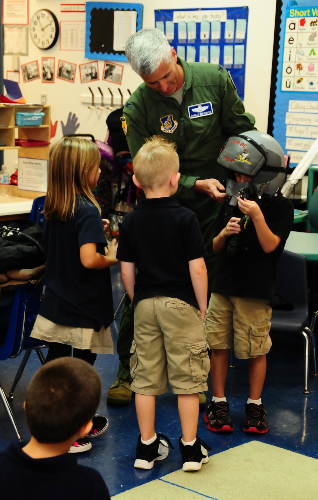 Col. Donald Drechsler, 36th Wing vice commander, gives a presentation of his job as a pilot during the Andersen Elementary School Career Day May 11. Several speakers from Andersen and the local community came to demonstrate career possibilities for children in several different grades. (U.S. Air Force photo by Airman 1st Class Marianique Santos/Released)