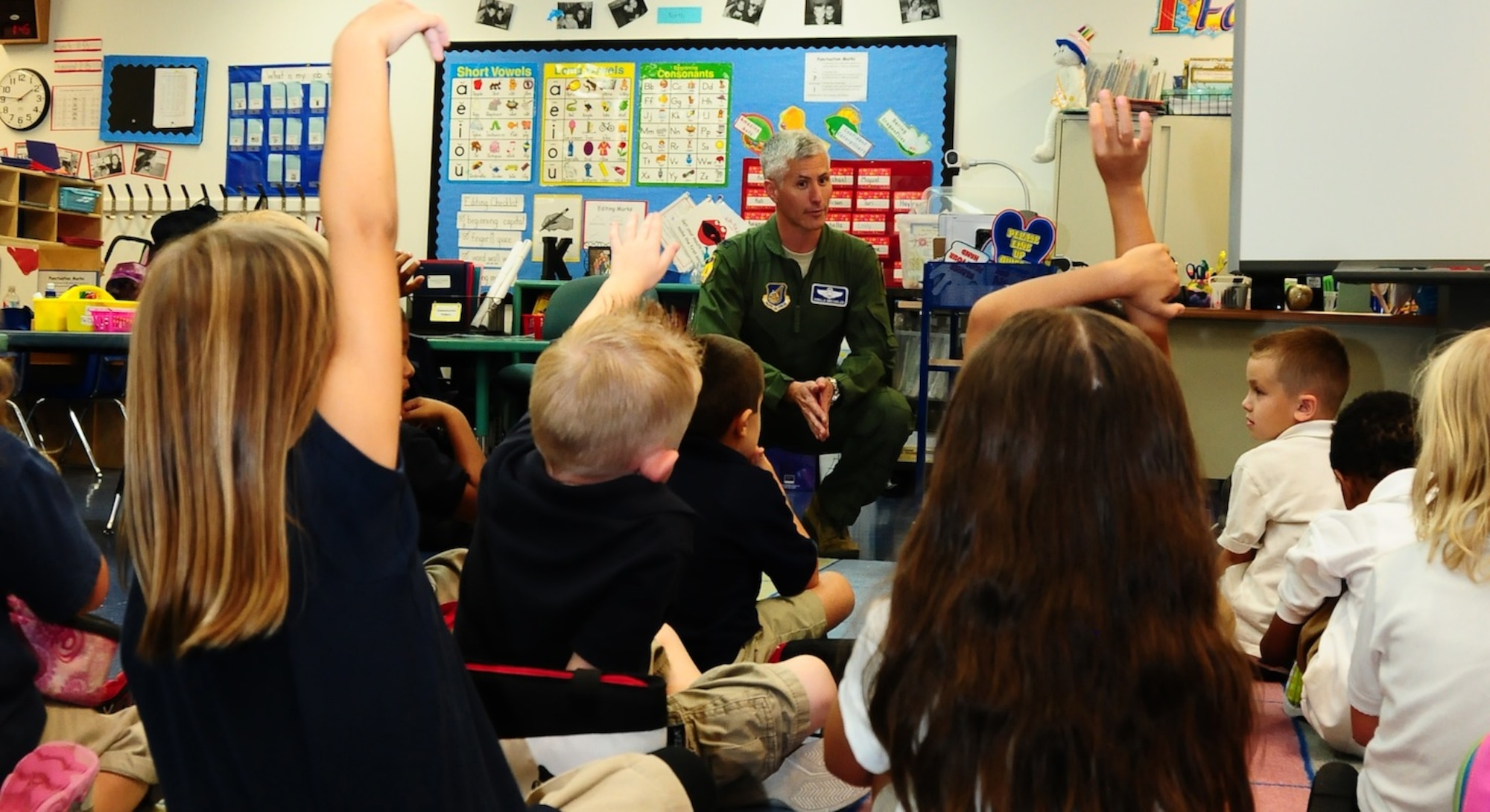 Col. Donald Drechsler, 36th Wing vice commander, answers questions during the Andersen Elementary School Career Day May 11. Several speakers from Andersen and the local community came to demonstrate career possibilities for children in several different grades. (U.S. Air Force photo by Airman 1st Class Marianique Santos/Released)